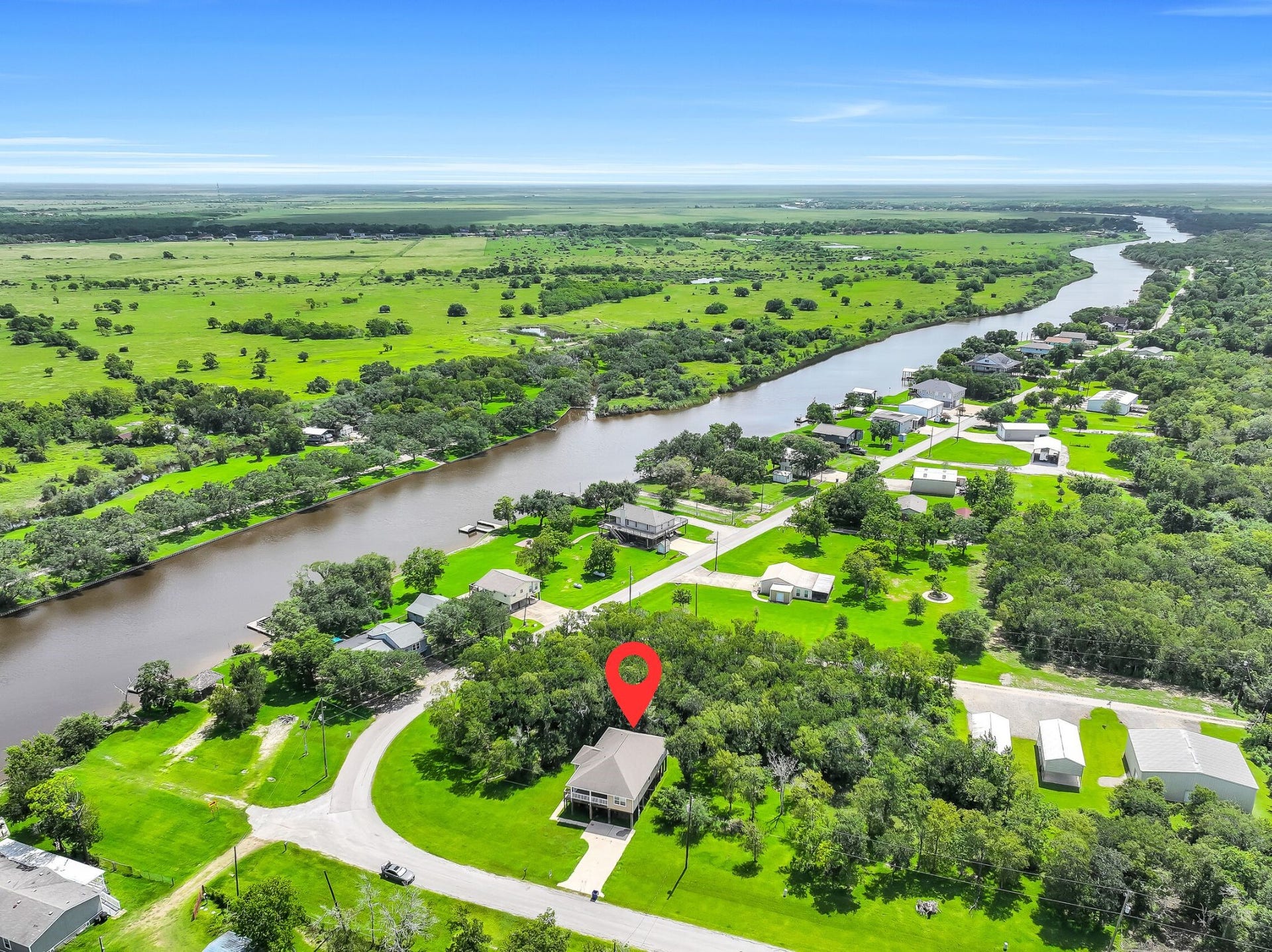 11930 Bastrop Beach Road, Angleton, TX 77515 Surrounded by towering oaks and nestled just off scenic Bastrop Bayou, this beautiful property offers the perfect balance of privacy and convenience. With a public boat ramp just steps away, fishing, kayaking, and boating are always within easy reach.
