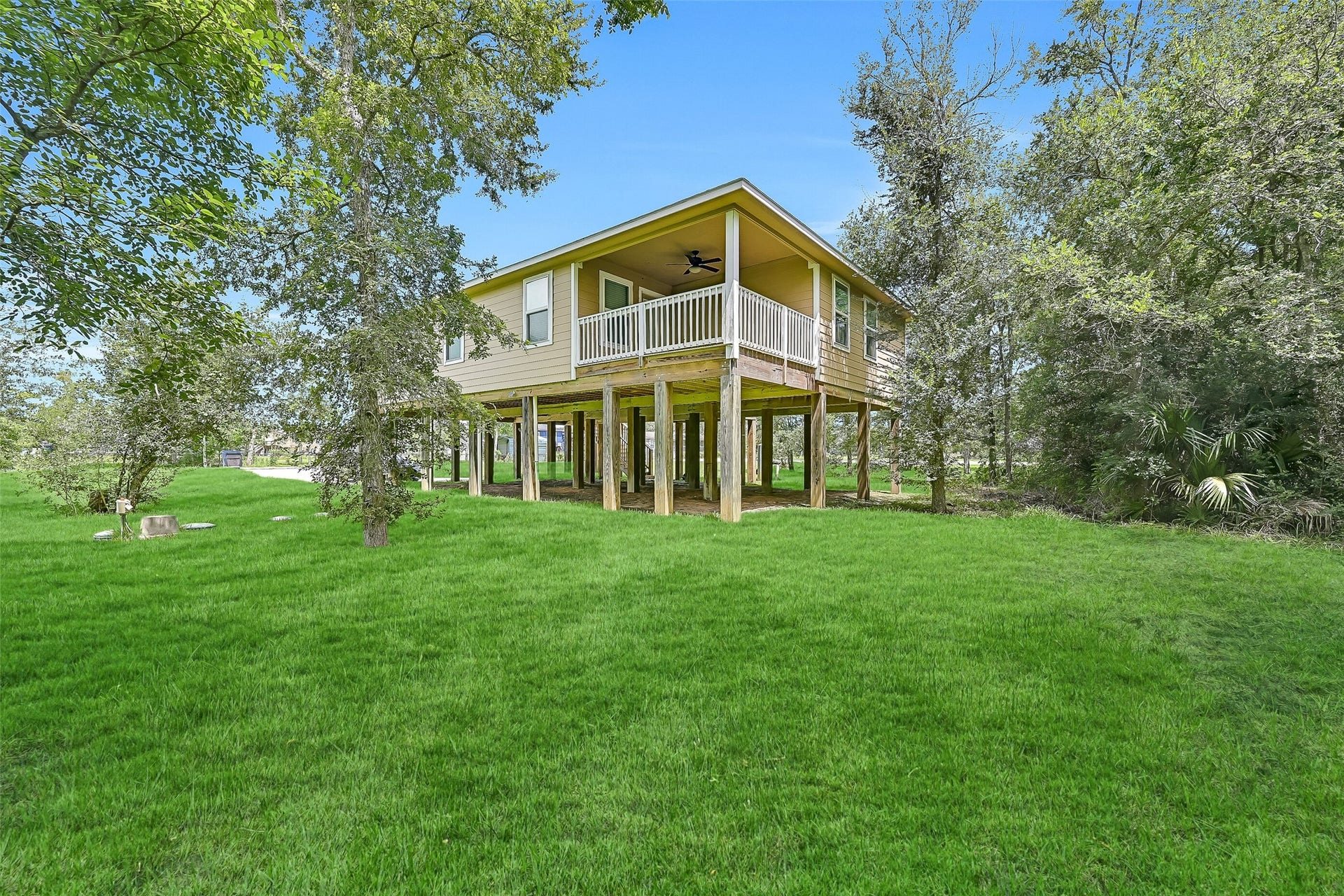 11930 Bastrop Beach Road, Angleton, TX 77515 Nestled on more than an acre beneath a canopy of mature trees, this peaceful backyard offers room to roam, relax, and enjoy the privacy of country living just moments from scenic Bastrop Bayou.