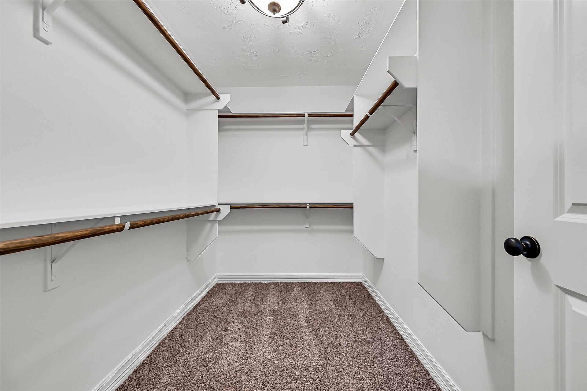 11930 Bastrop Beach Road, Angleton, TX 77515 A generously sized walk-in closet provides abundant hanging space and room to keep wardrobes, seasonal dcor, and everyday essentials neatly organized.