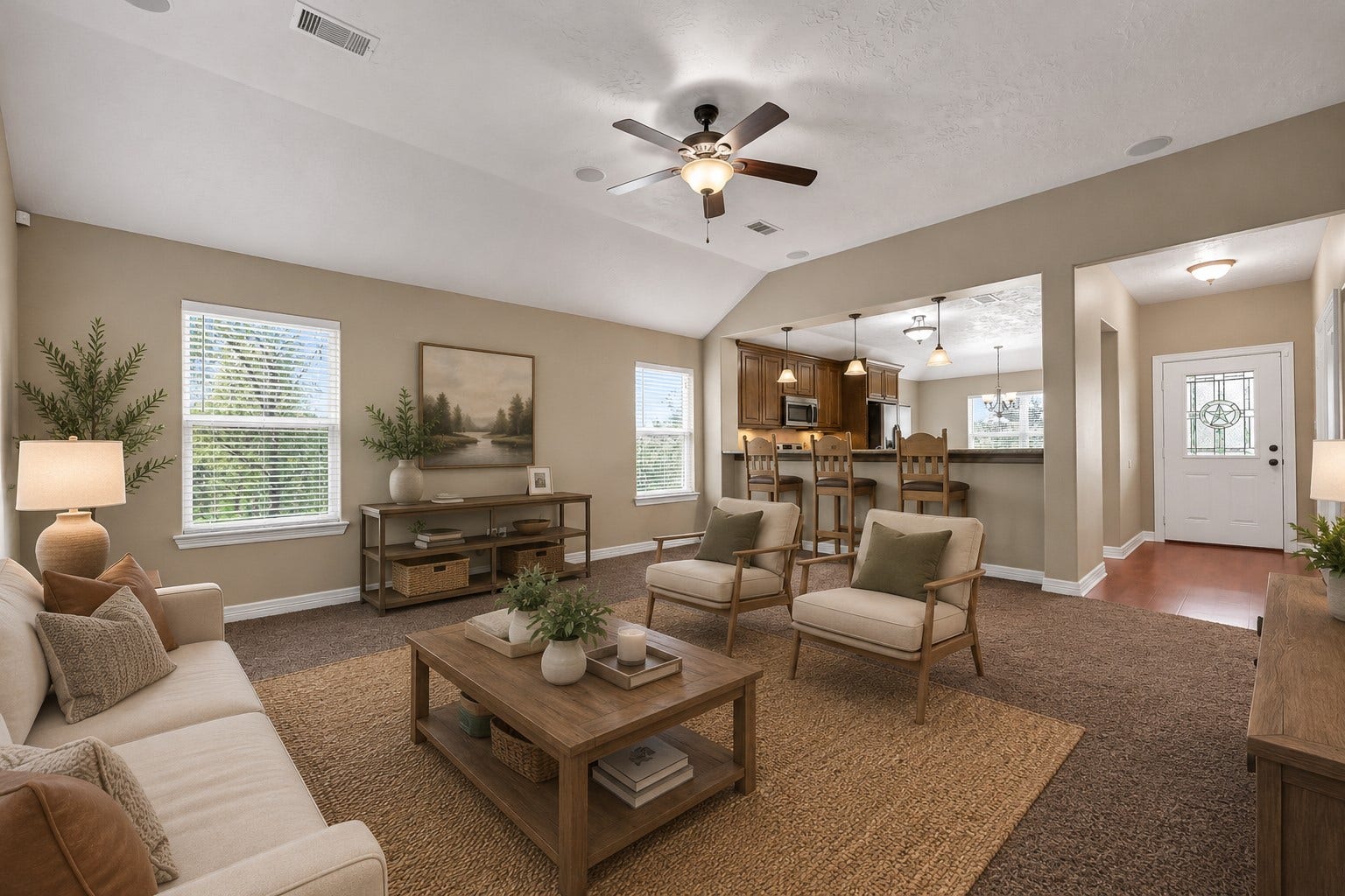 11930 Bastrop Beach Road, Angleton, TX 77515 The inviting family room welcomes you with a vaulted ceiling, neutral finishes, surround sound speakers, and an open-concept layout that keeps everyone connected. Large windows fill the space with natural light while creating an easy flow into the kitchen and dining area. (Virtually Staged)
