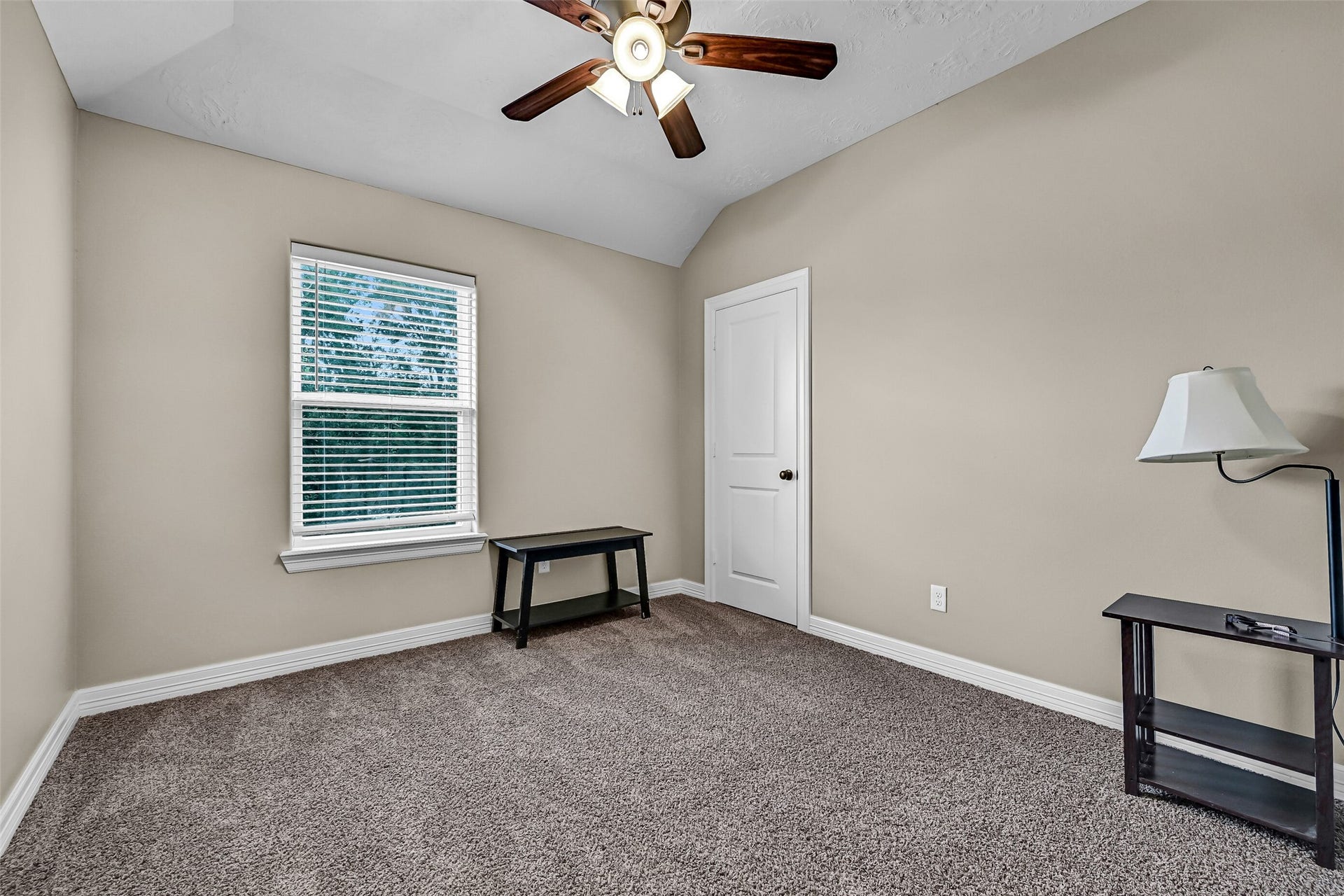 11930 Bastrop Beach Road, Angleton, TX 77515 The second secondary bedroom also offers a vaulted ceiling, lighted ceiling fan, and plenty of space for family, guests, or a comfortable home office.