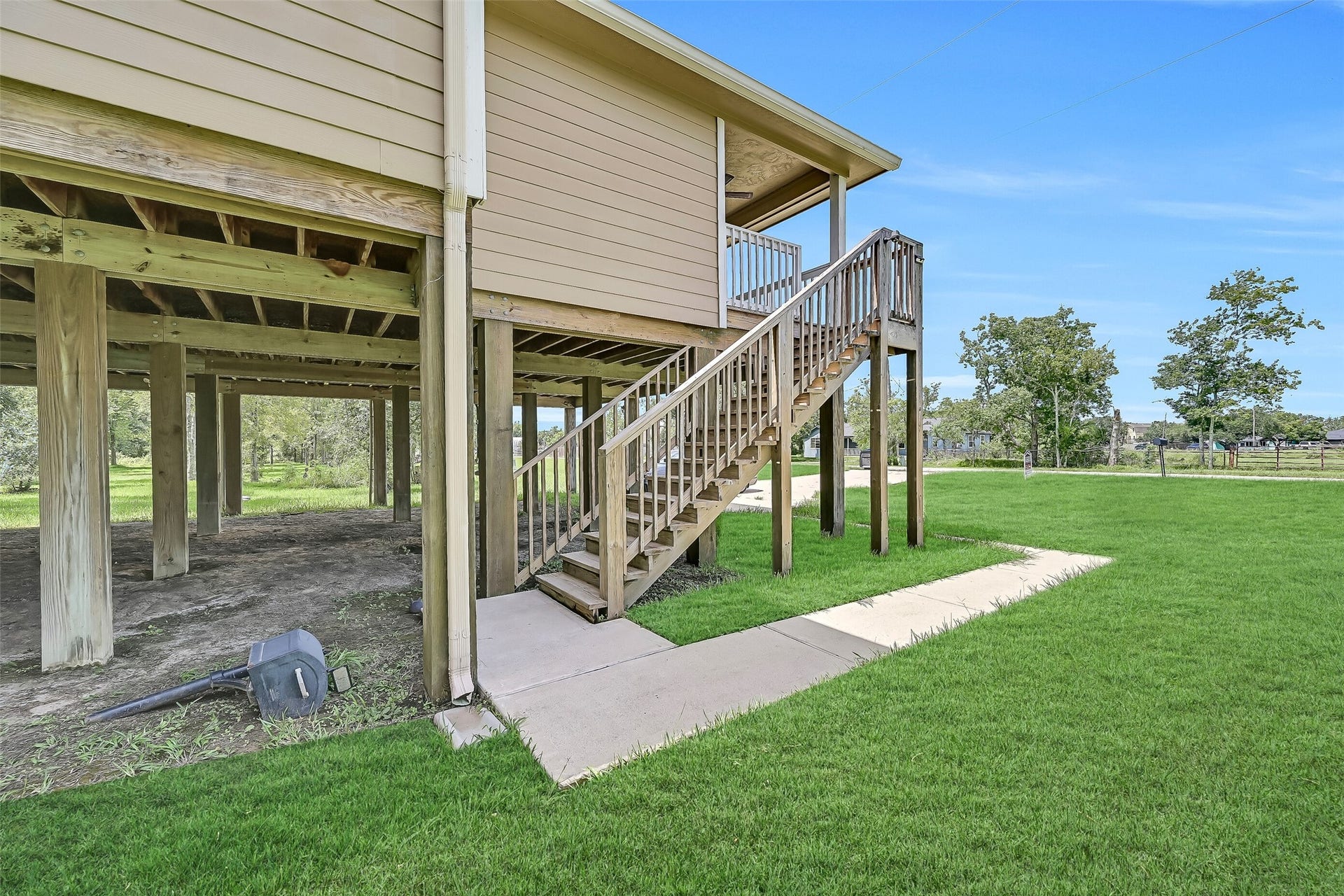 11930 Bastrop Beach Road, Angleton, TX 77515 Built on sturdy 10-foot pillars, the elevated design offers peace of mind, exceptional functionality, and convenient access to the expansive covered space below while maximizing the home's efficiency with added foam insulation beneath the floor system.