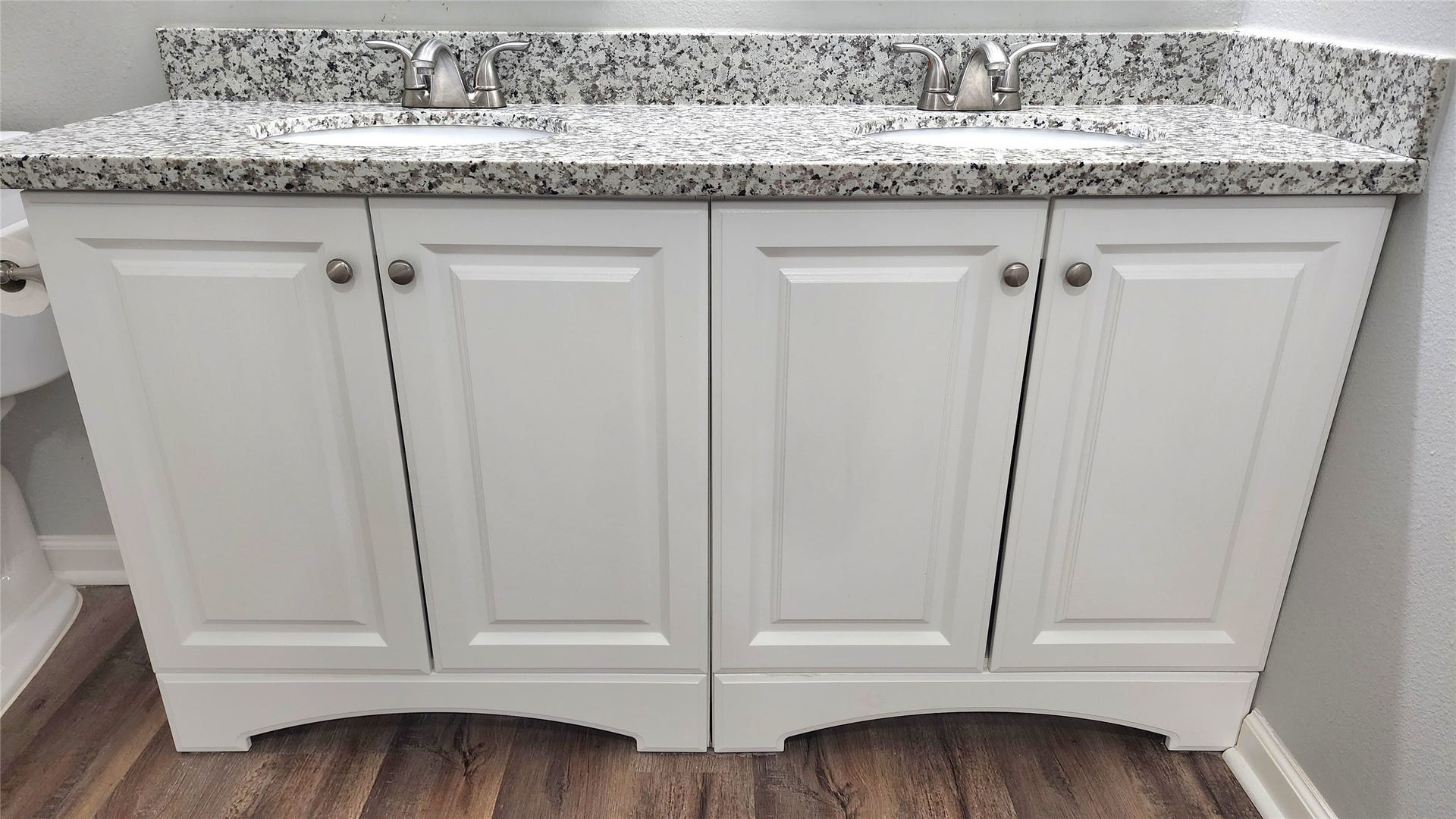 419 N Parrish Street, Angleton, TX 77515 Closer look at the double vanity with granite top and cabinet storage below.