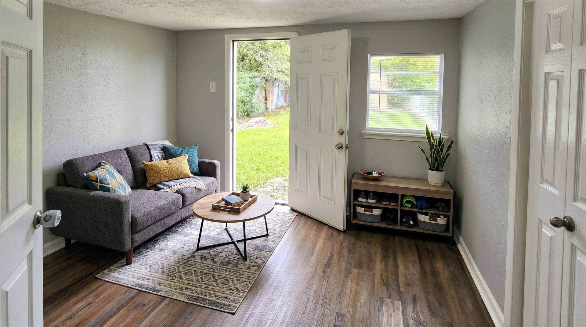 419 N Parrish Street, Angleton, TX 77515 Den with a door to the backyard. Use it as a second living area, home office, or playroom. Virtually staged.