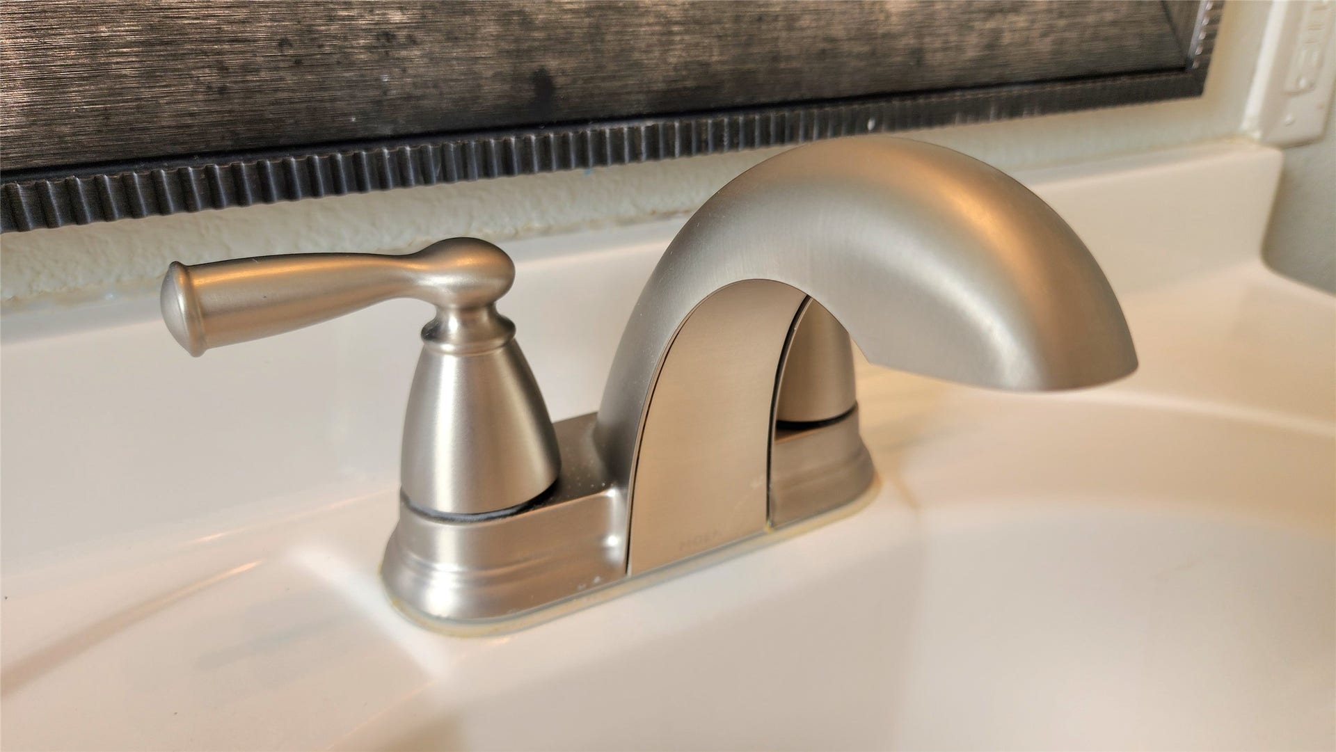 419 N Parrish Street, Angleton, TX 77515 Brushed nickel faucet in the hallway bath.