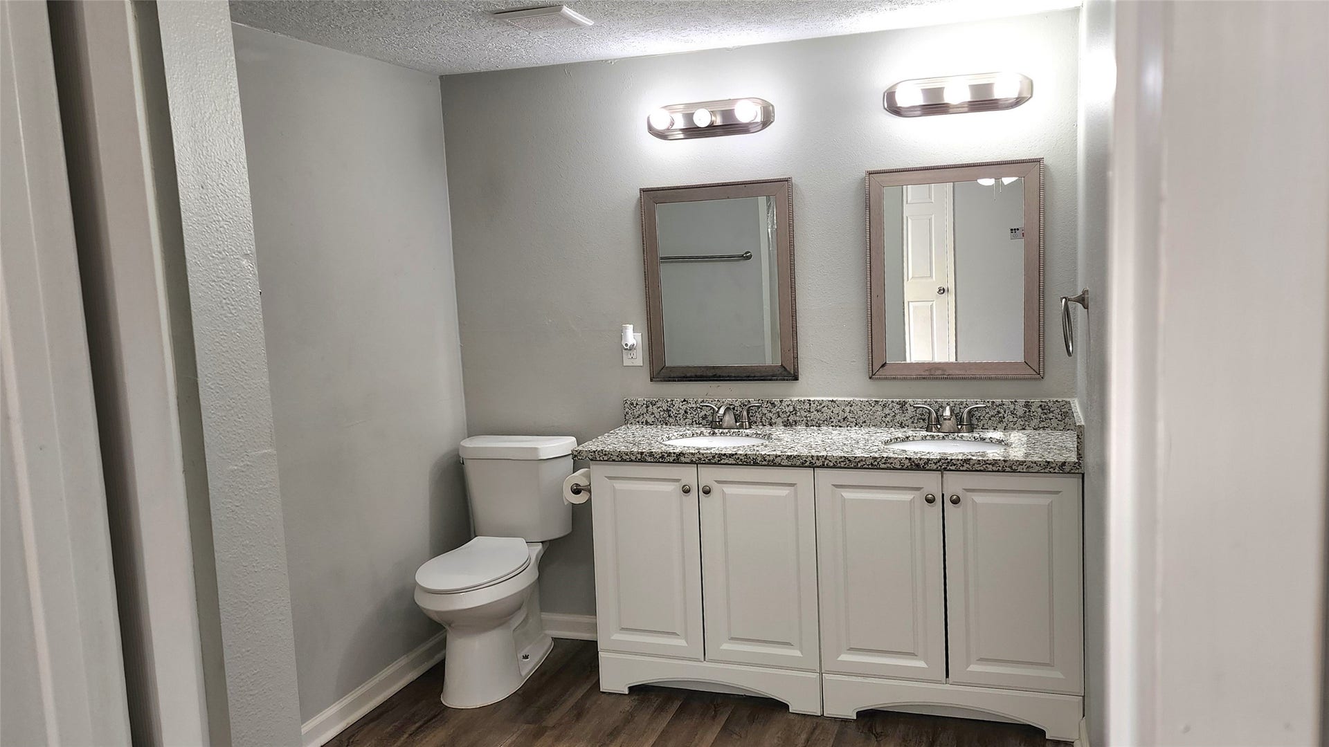 419 N Parrish Street, Angleton, TX 77515 Primary bath with a double vanity and granite countertop.