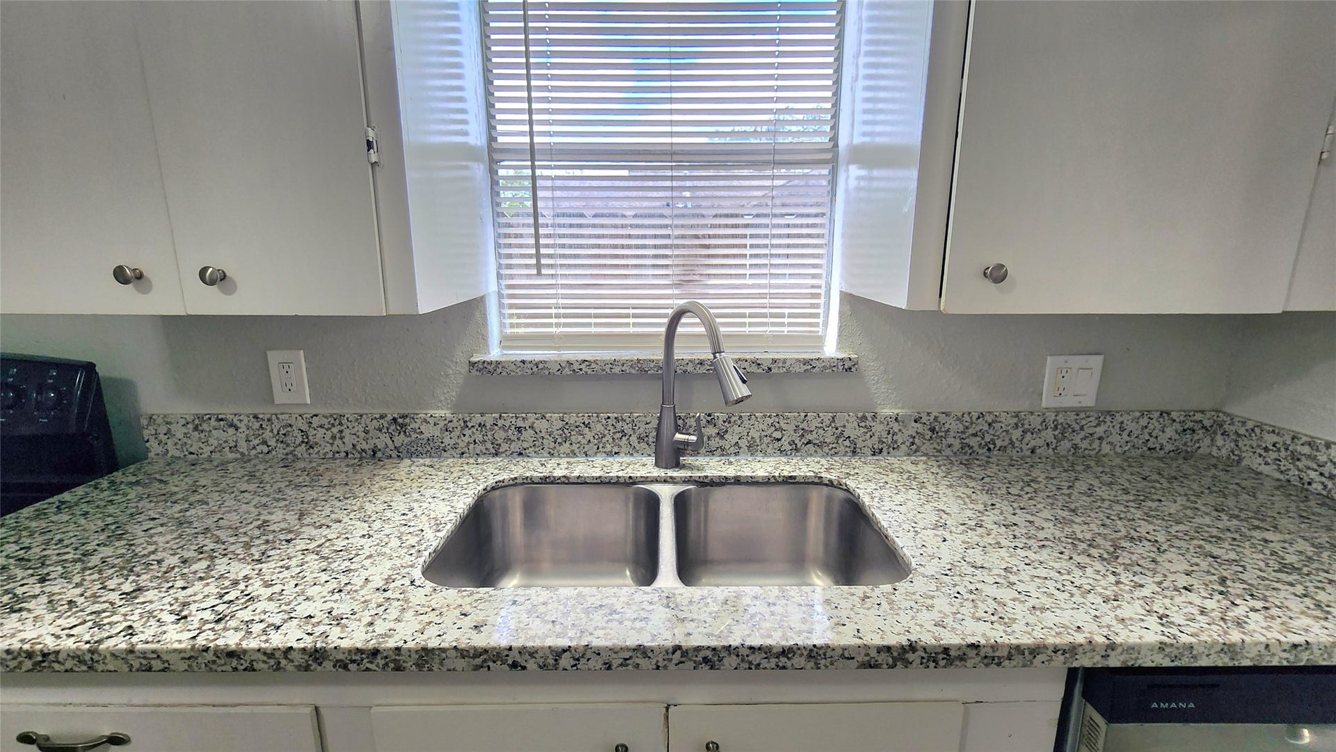 419 N Parrish Street, Angleton, TX 77515 Double stainless sink beneath the kitchen window.