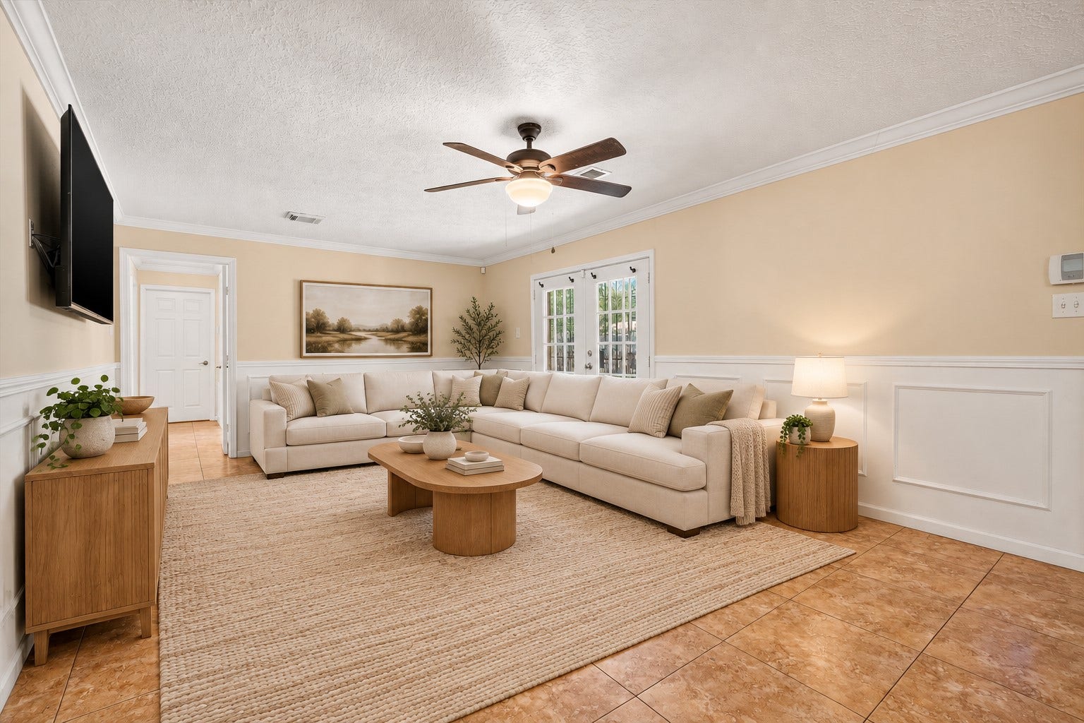 Another view of this gorgeous living room highlights the elegant chair rail molding. *Virtually Staged