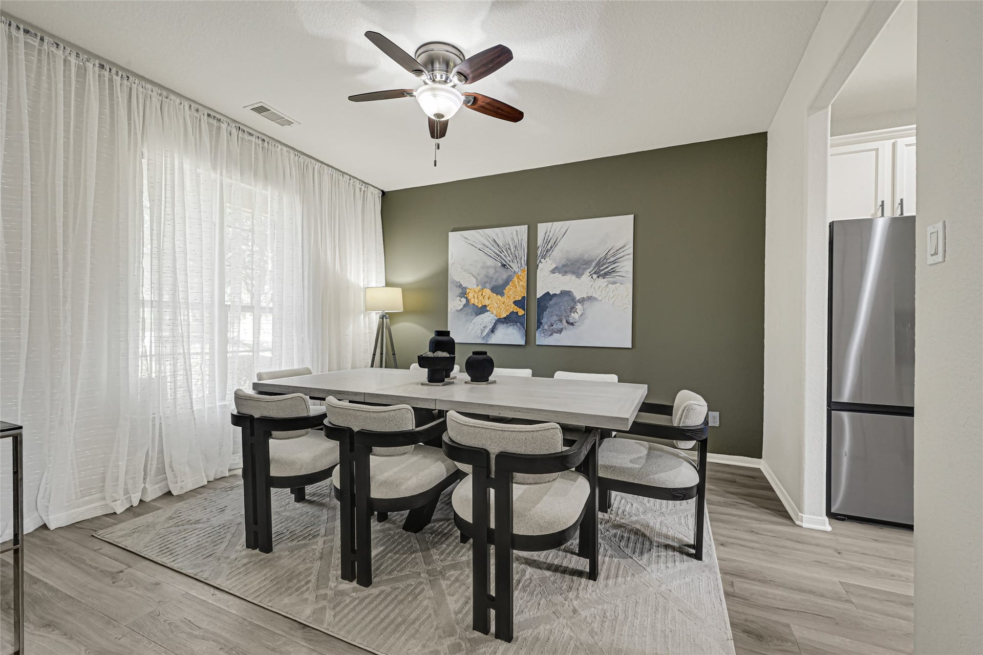 Contemporary paint color makes the home and dining room light and bright.