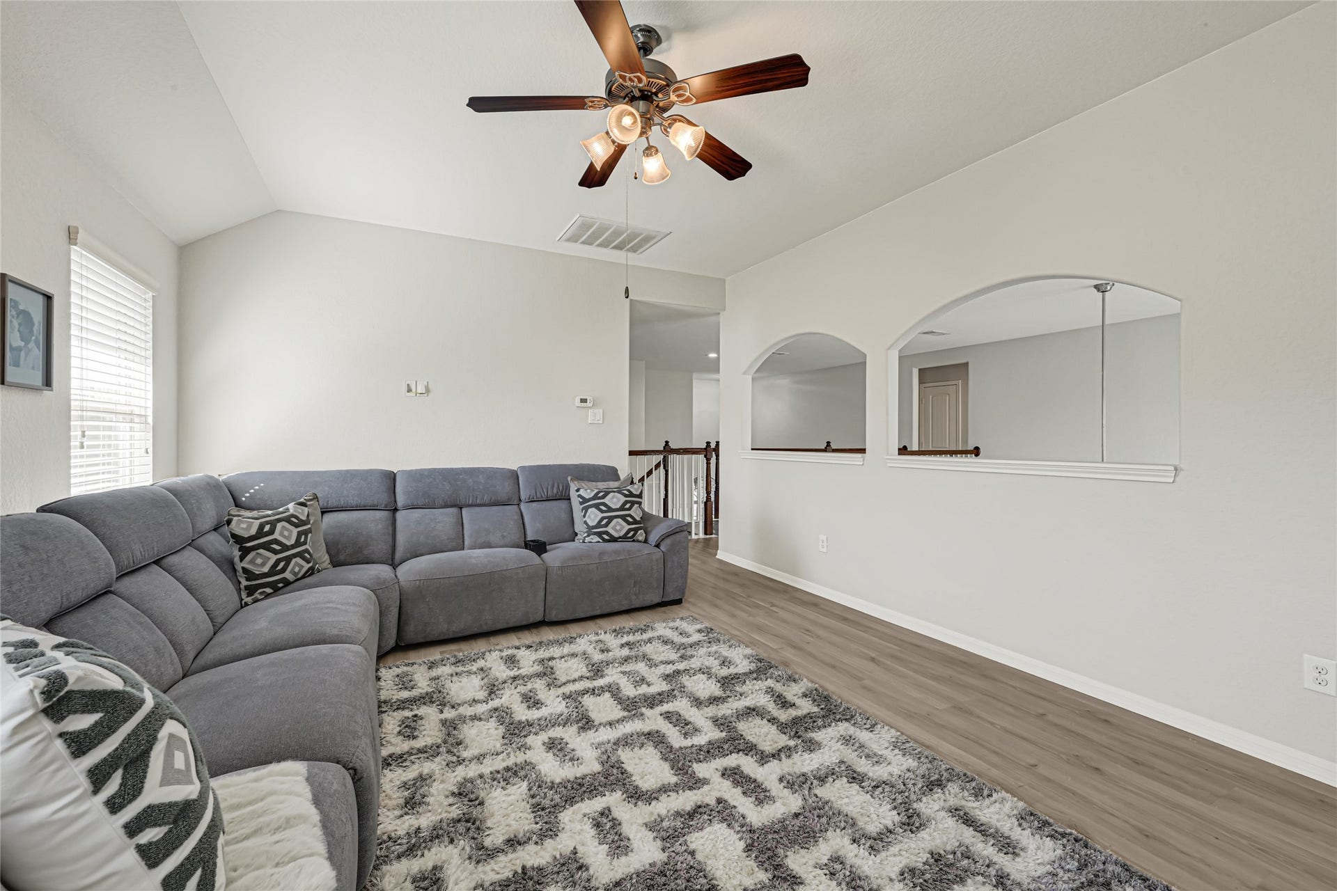 Another view of the gameroom with arch openings. View of the living room below.