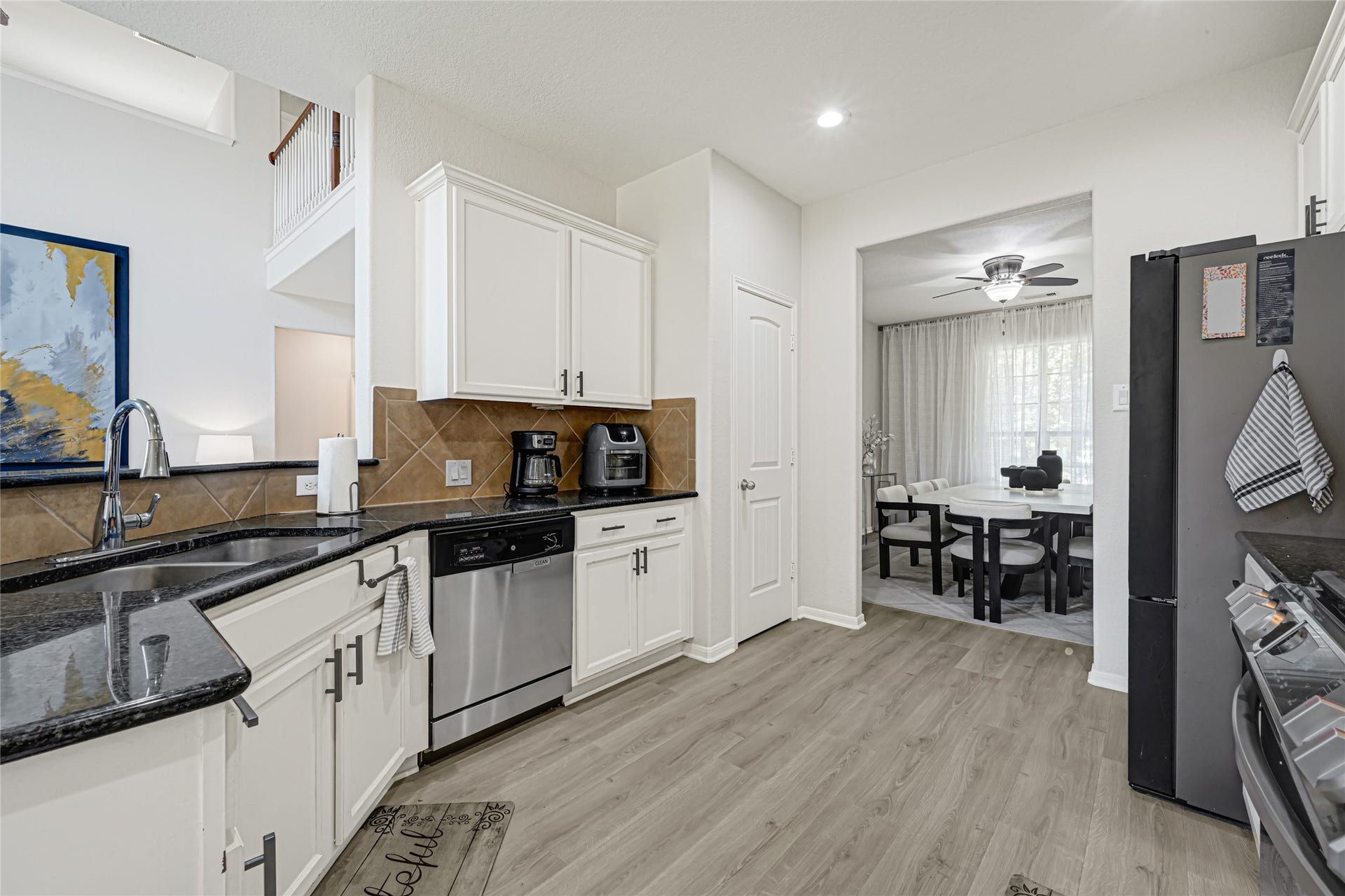 Modern flooring throughout the home. Makes all the spaces more open and contemporary.