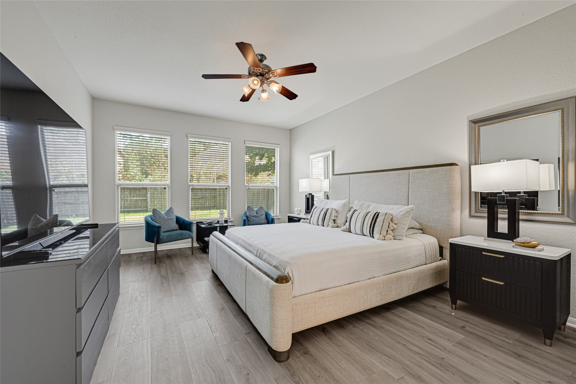 Huge primary bedroom with modern flooring. Plenty of space for all your large furniture