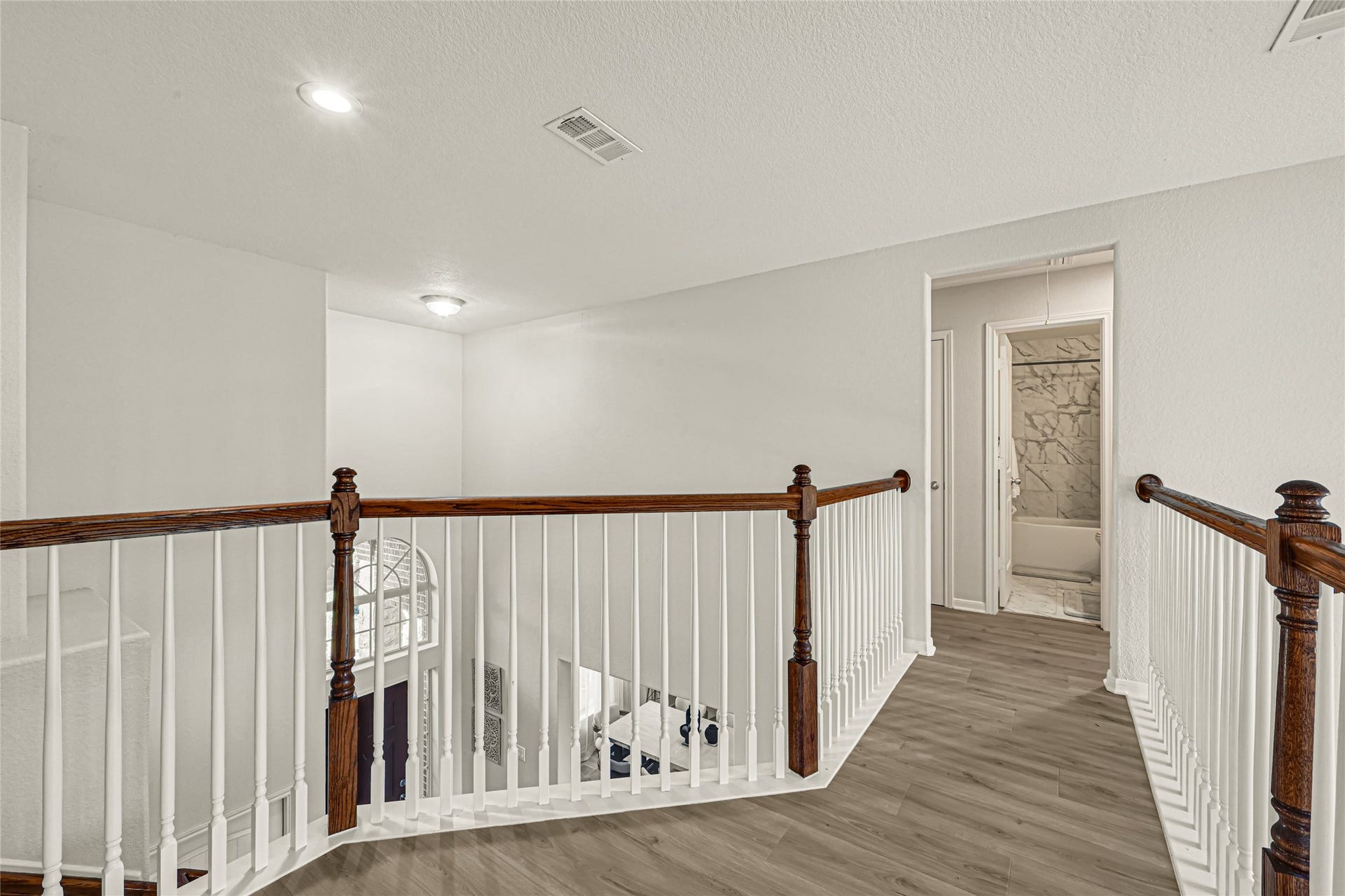 Another view of the walkway leading to the other bedrooms and bathroom