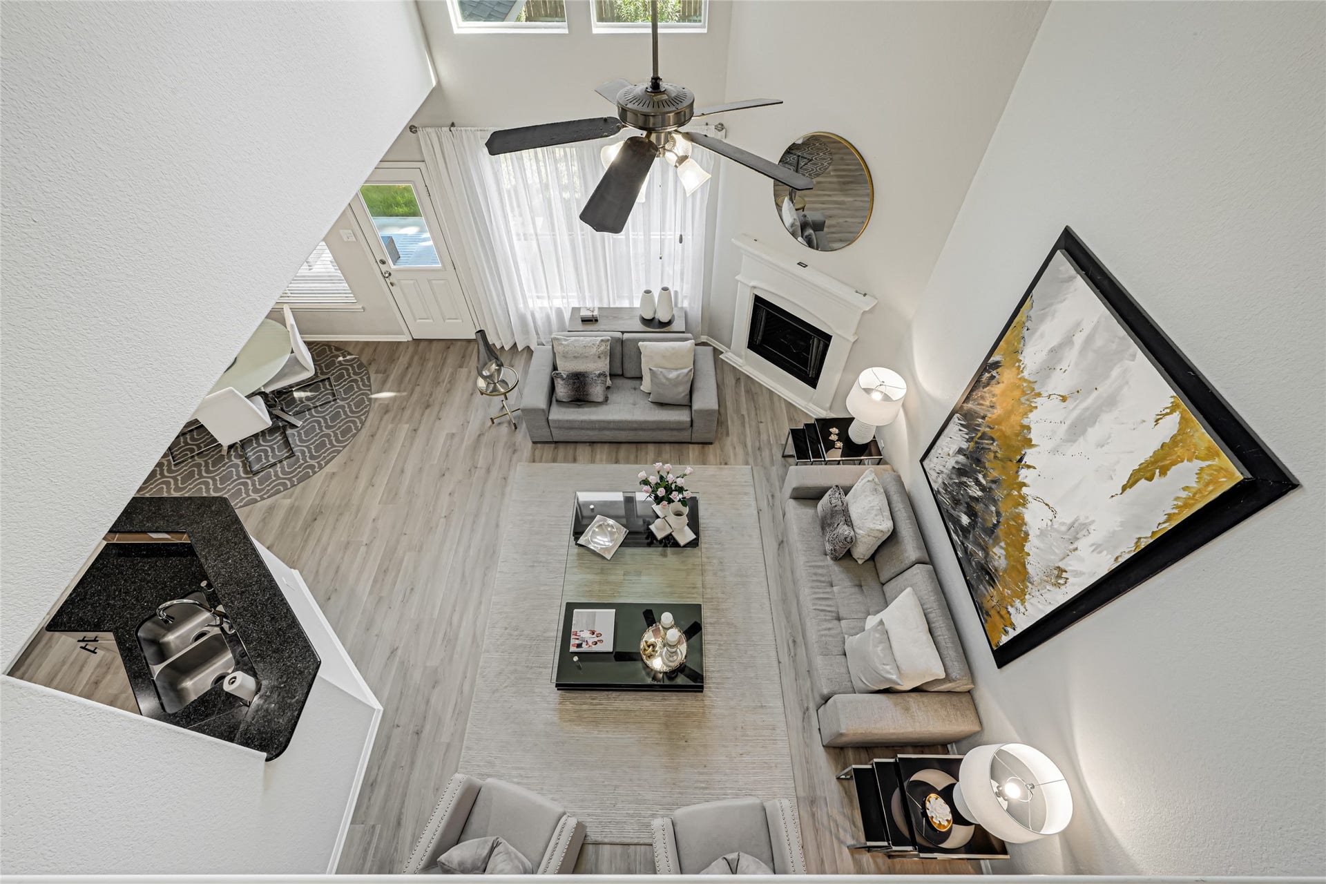 View from the upstairs walkway into the large and bright living room