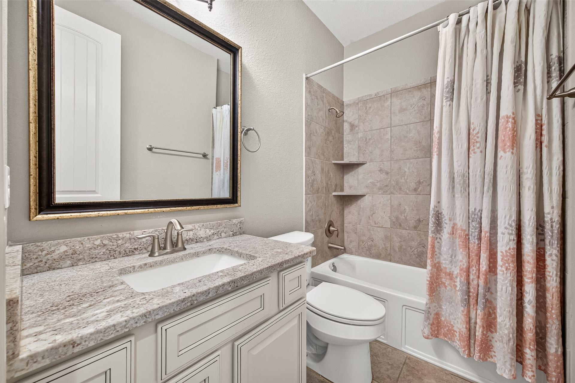2 additional full bathrooms (2 of 2) featuring granite countertops and shower/tub combinations.