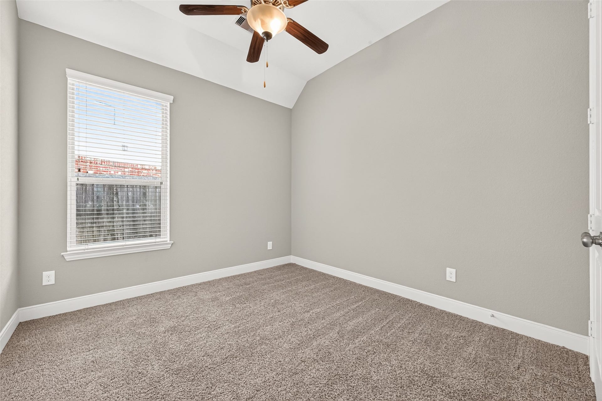 Two nice sized secondary bedrooms (2 of 2) offer plush carpeting and spacious closets.