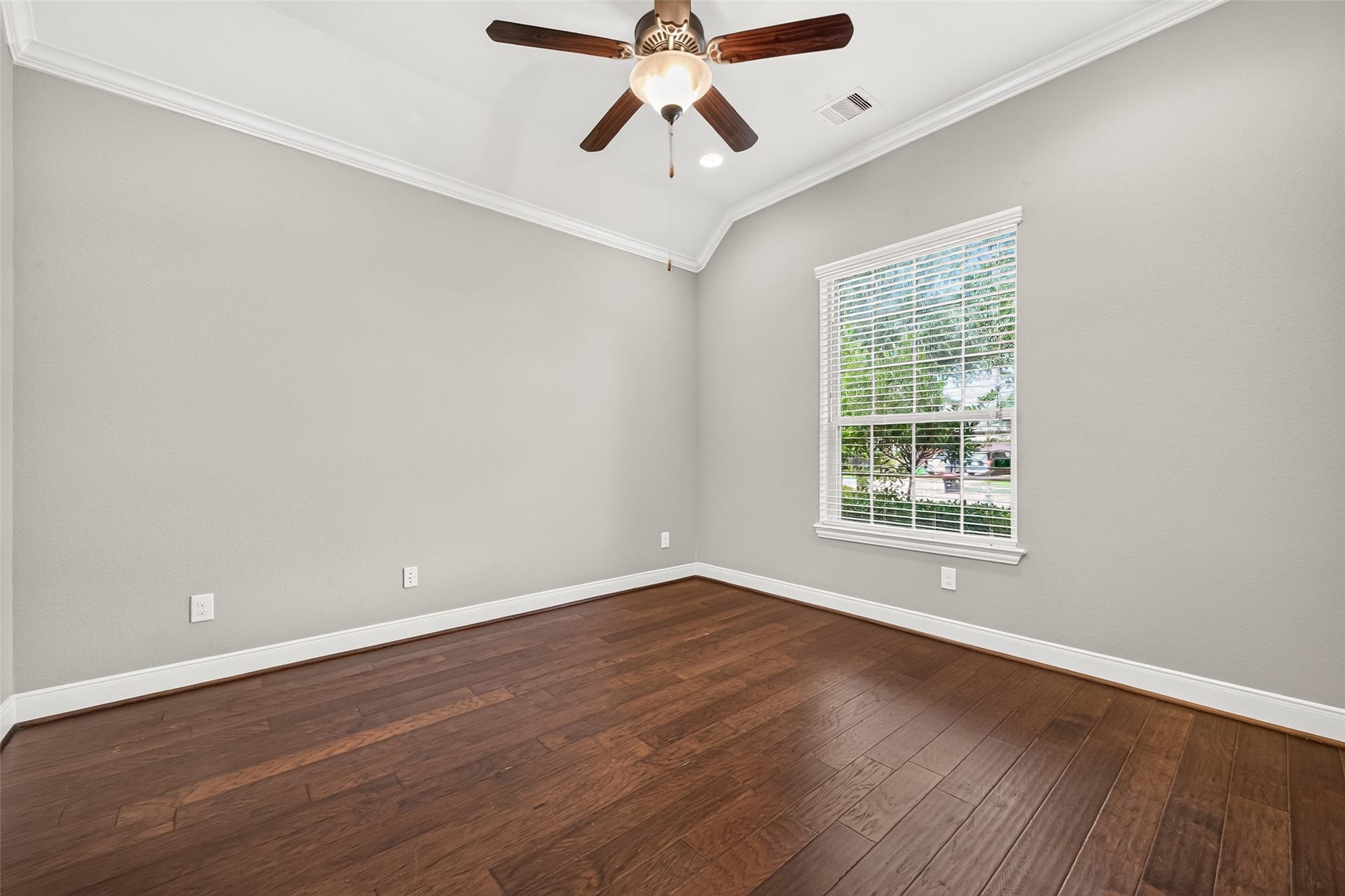 Near the front of the home, a private home office with double doors provides the perfect space for working or studying from home.