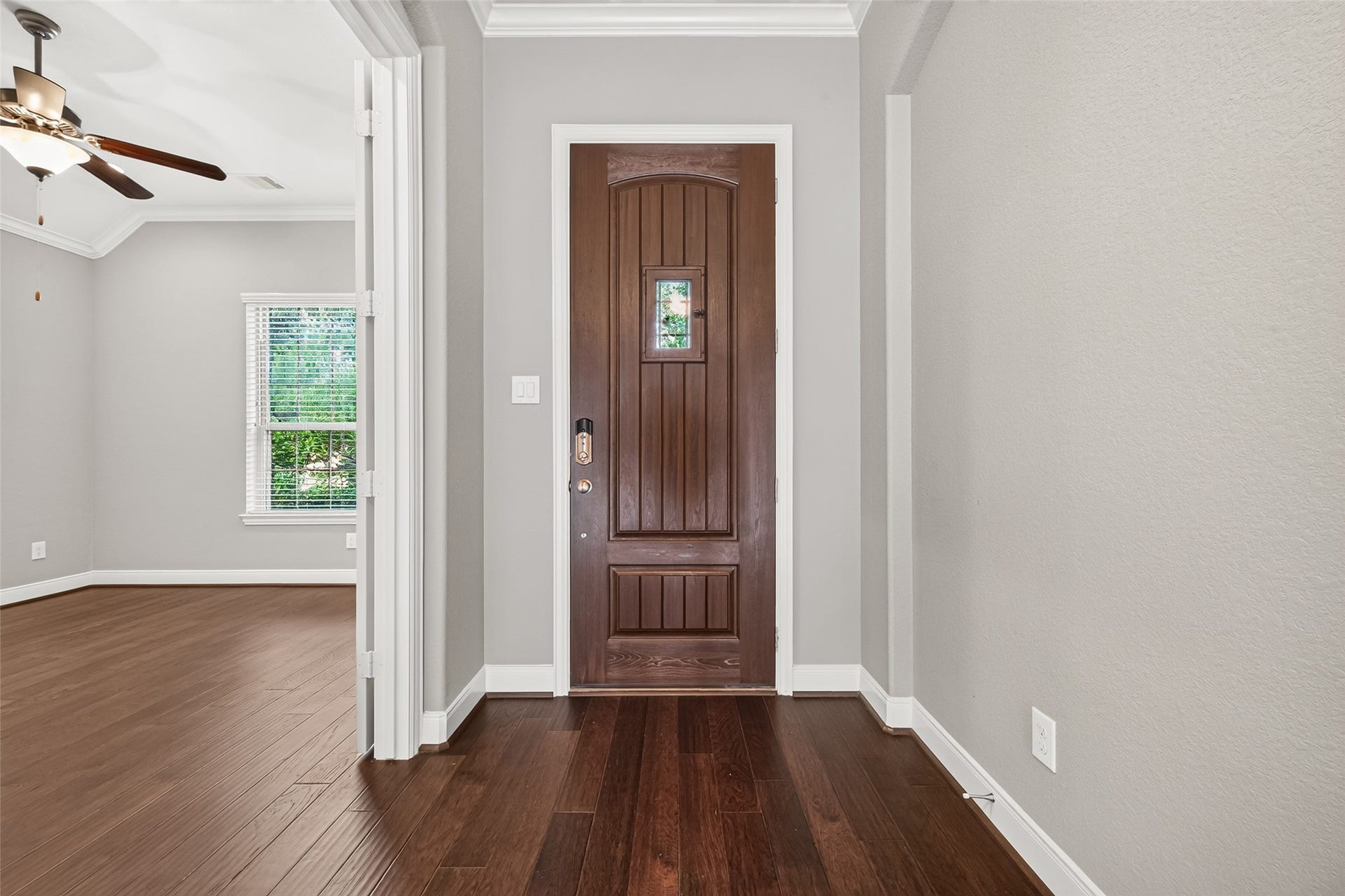 Step inside to an open foyer where beautiful archways, 8-foot interior doors, recessed lighting, and wood flooring throughout the main living areas add warmth and character.