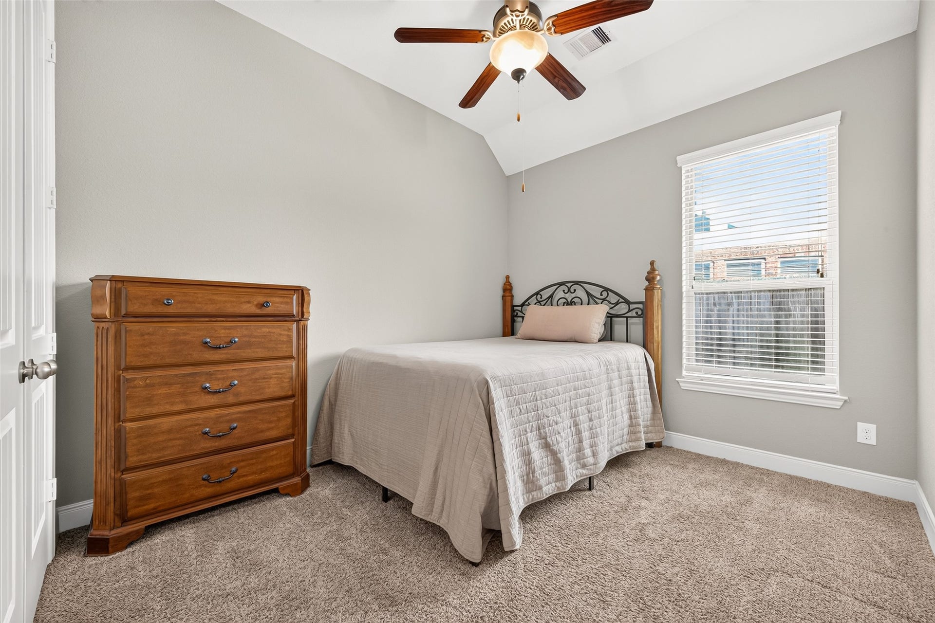 Two nice sized secondary bedrooms (1 of 2) offer plush carpeting and spacious closets.