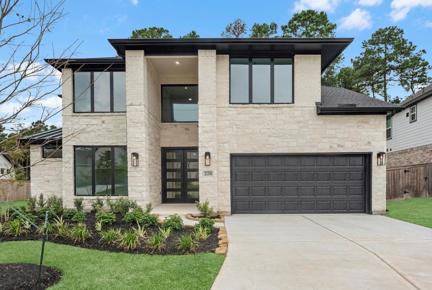 228 Warbler Song Drive, Willis, TX 77318 Move-In Ready! Westin Homes | Archer III New Construction. Grass is digitally enhanced.