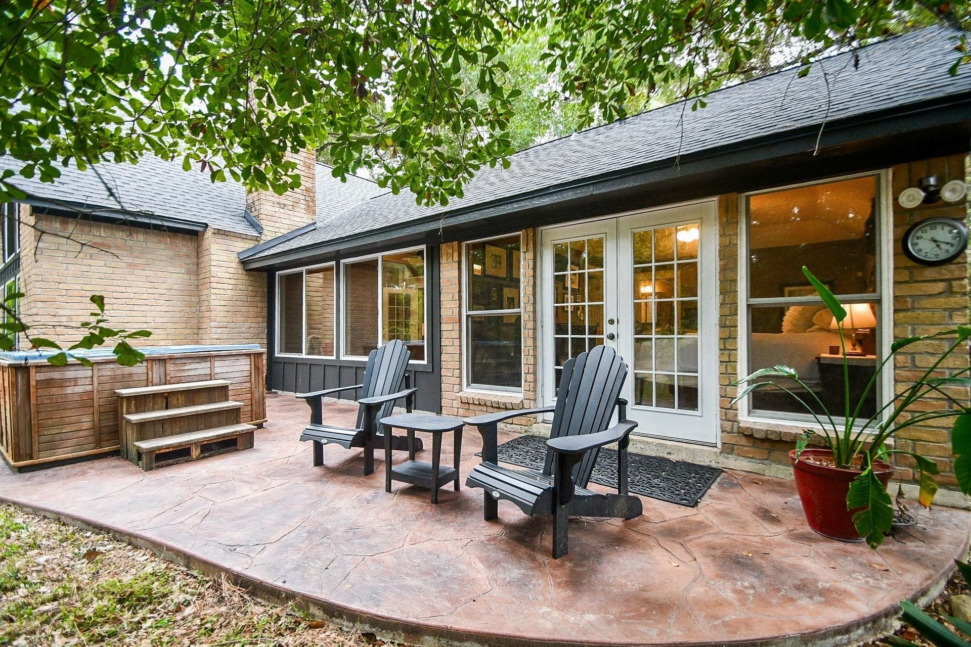 Patio Area with Hot Tub outside the Primary Bedroom.