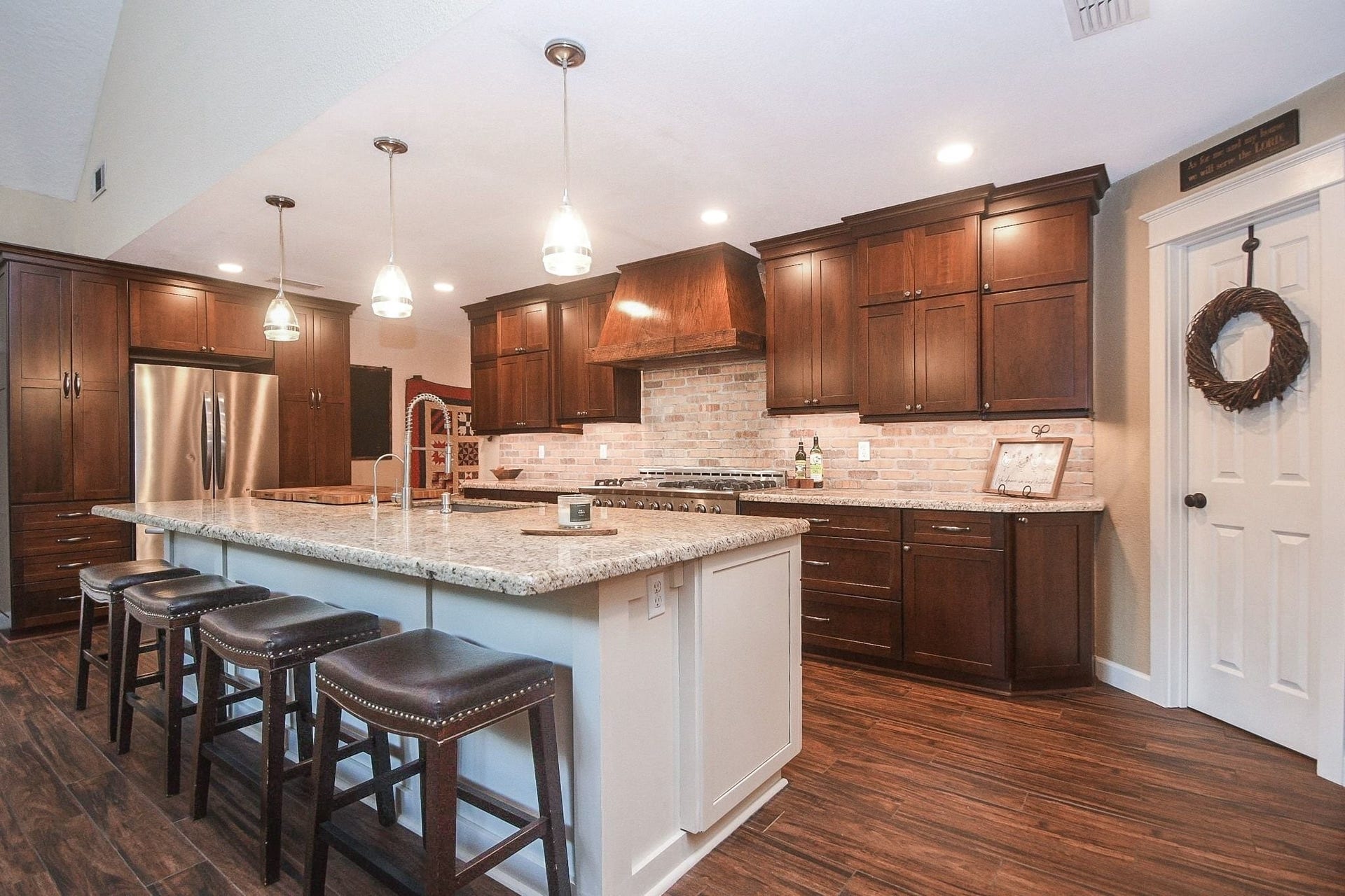 Open Island Kitchen with Custom Cabinets, a Professional NXP Pro 6-Burner Gas Range with Griddle & Large Walk-In Pantry. Large Utility Room.