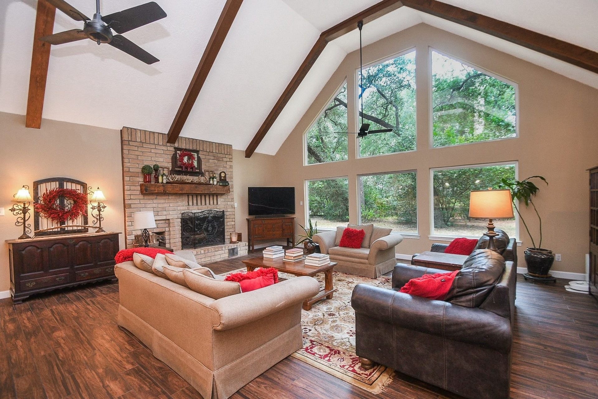 This Beautifully Updated Elegant Brick Home has an Over-Sized Living Area with High Ceilings, 2-Story Windows and a Brick-Faced Wood Burning Fireplace.