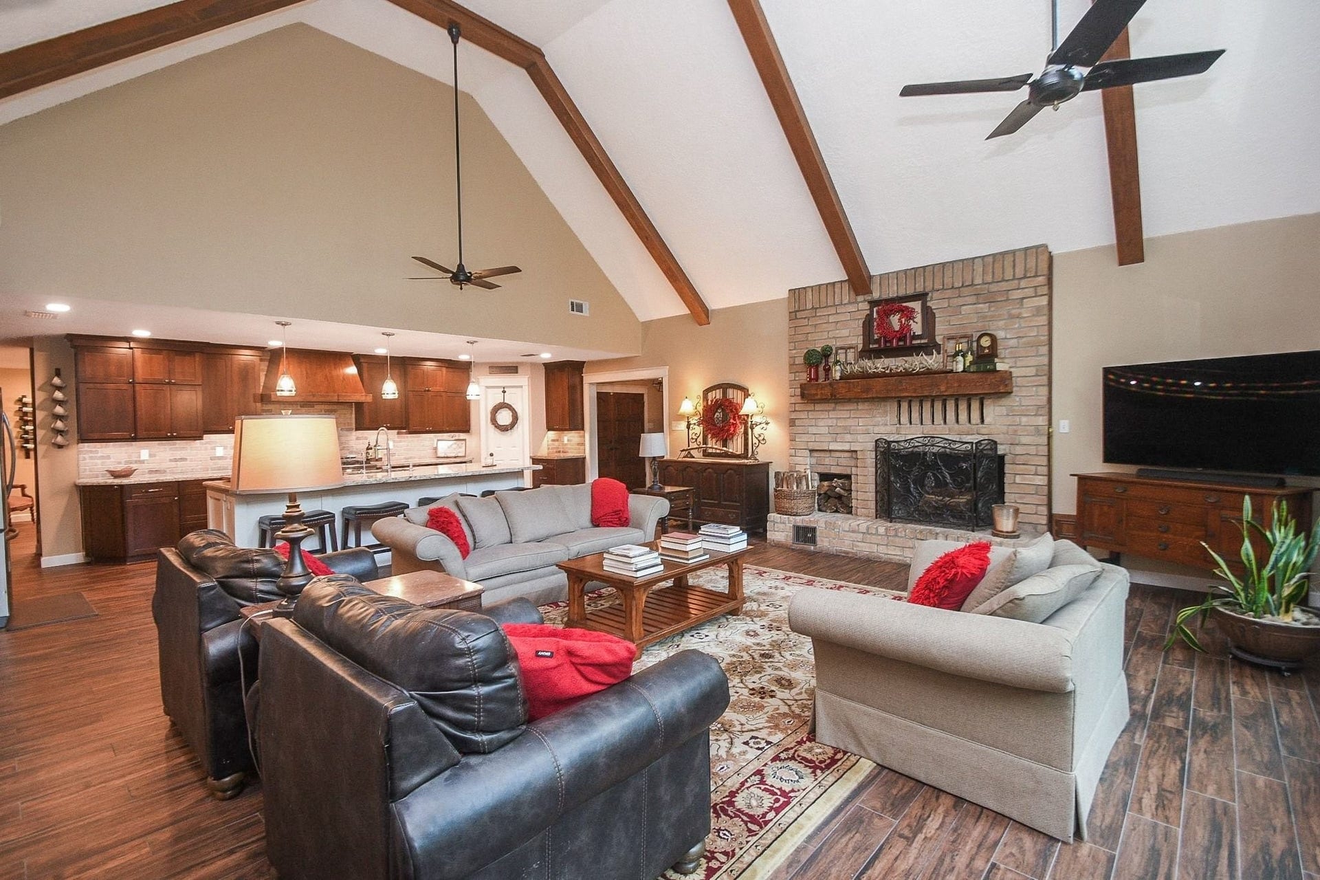 This Beautifully Updated Elegant Brick Home has an Over-Sized Living Area with High Ceilings, 2-Story Windows and a Brick-Faced Wood Burning Fireplace.