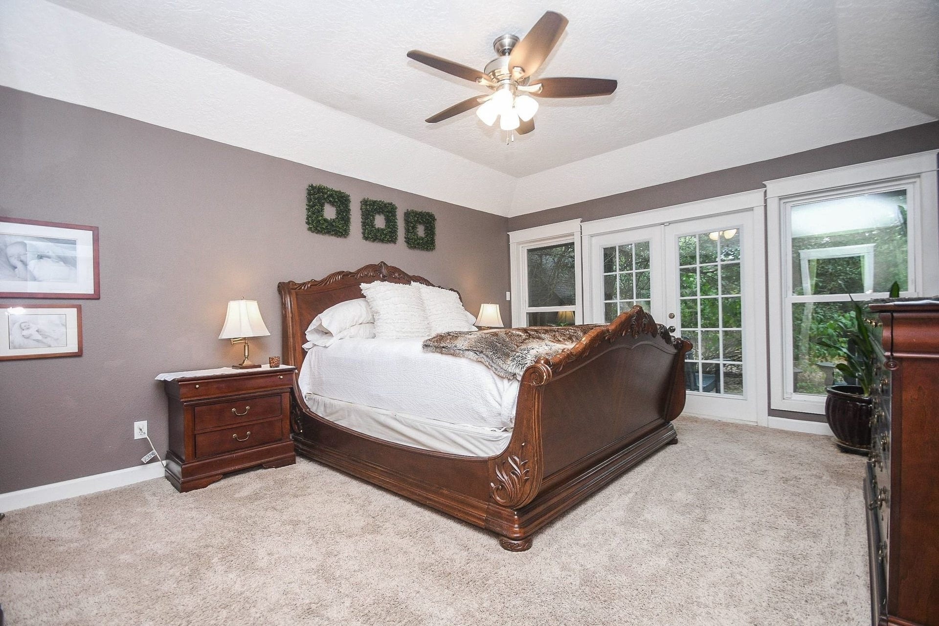 The Primary Bedroom has Double French Doors leading to the Back Yard Patio with Hot Tub.