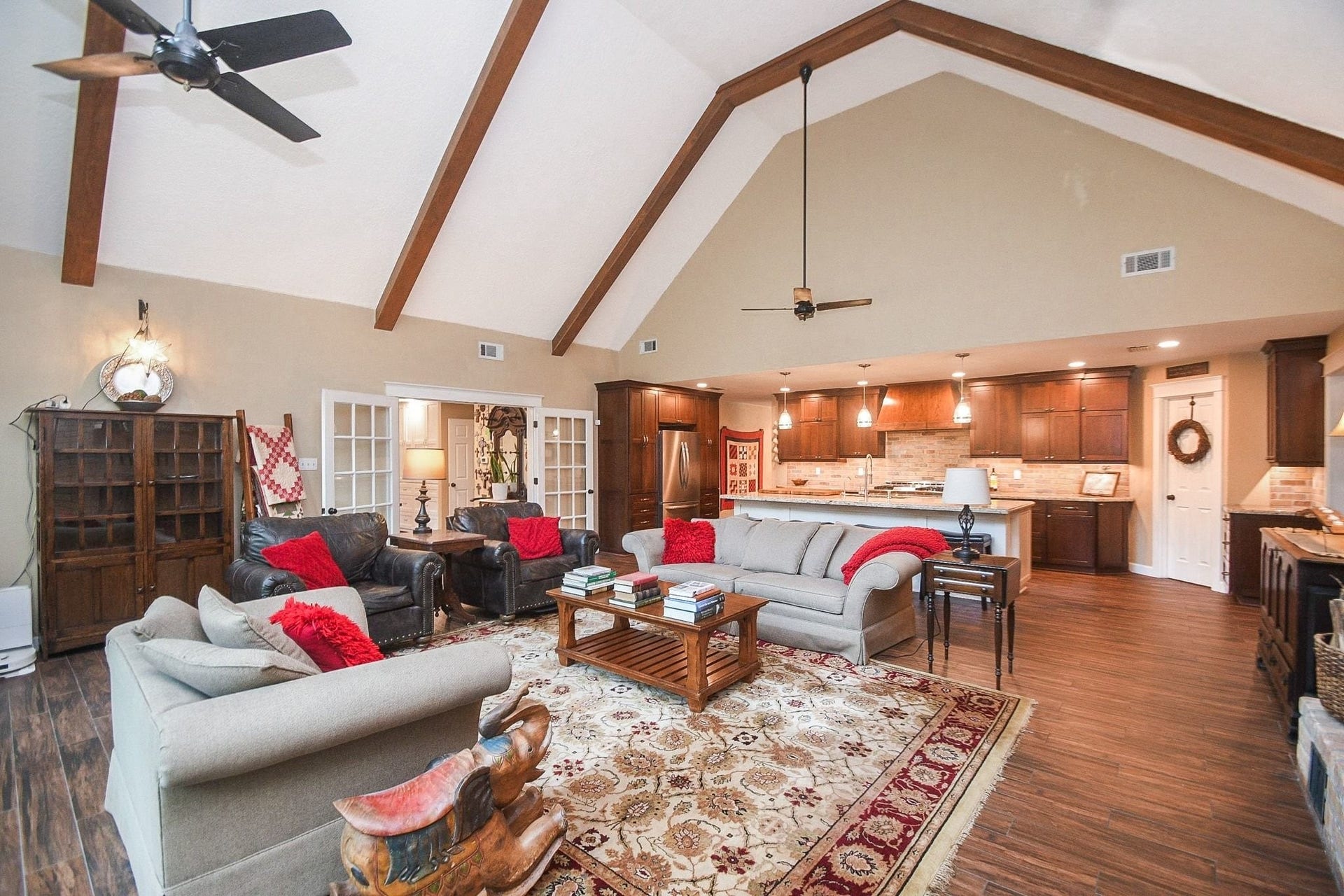 This Beautifully Updated Elegant Brick Home has an Over-Sized Living Area with High Ceilings, 2-Story Windows and a Brick-Faced Wood Burning Fireplace.
