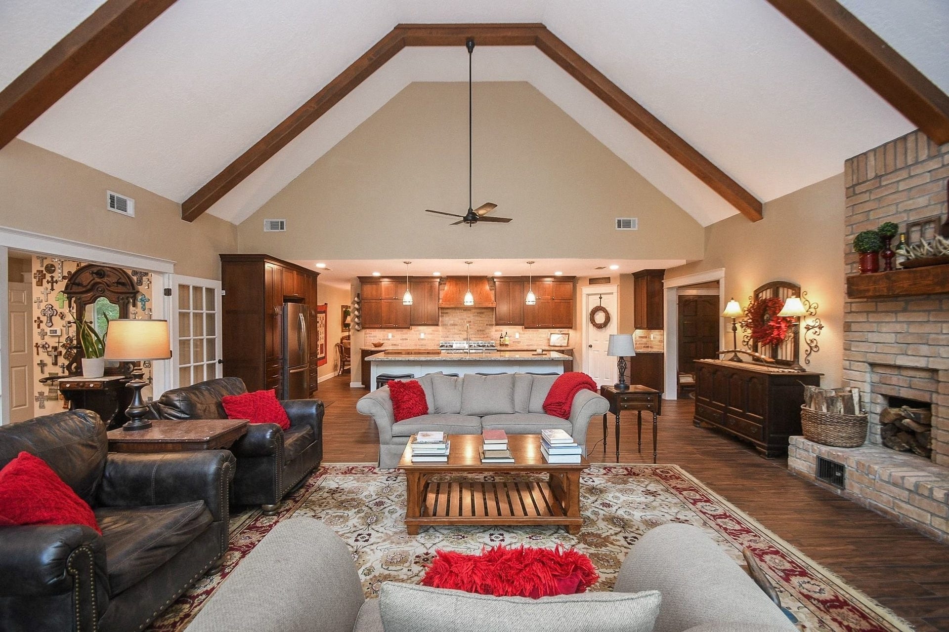 This Beautifully Updated Elegant Brick Home has an Over-Sized Living Area with High Ceilings, 2-Story Windows and a Brick-Faced Wood Burning Fireplace.