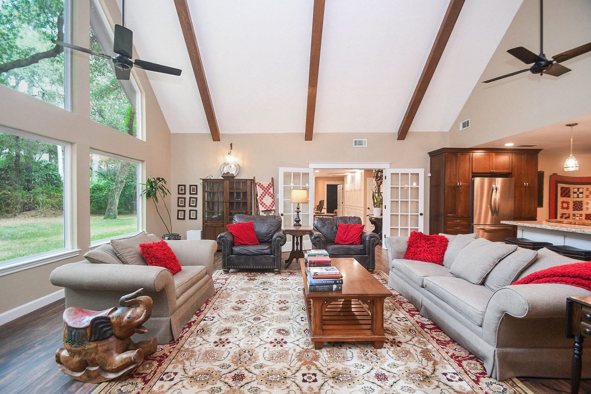 This Beautifully Updated Elegant Brick Home has an Over-Sized Living Area with High Ceilings, 2-Story Windows and a Brick-Faced Wood Burning Fireplace.