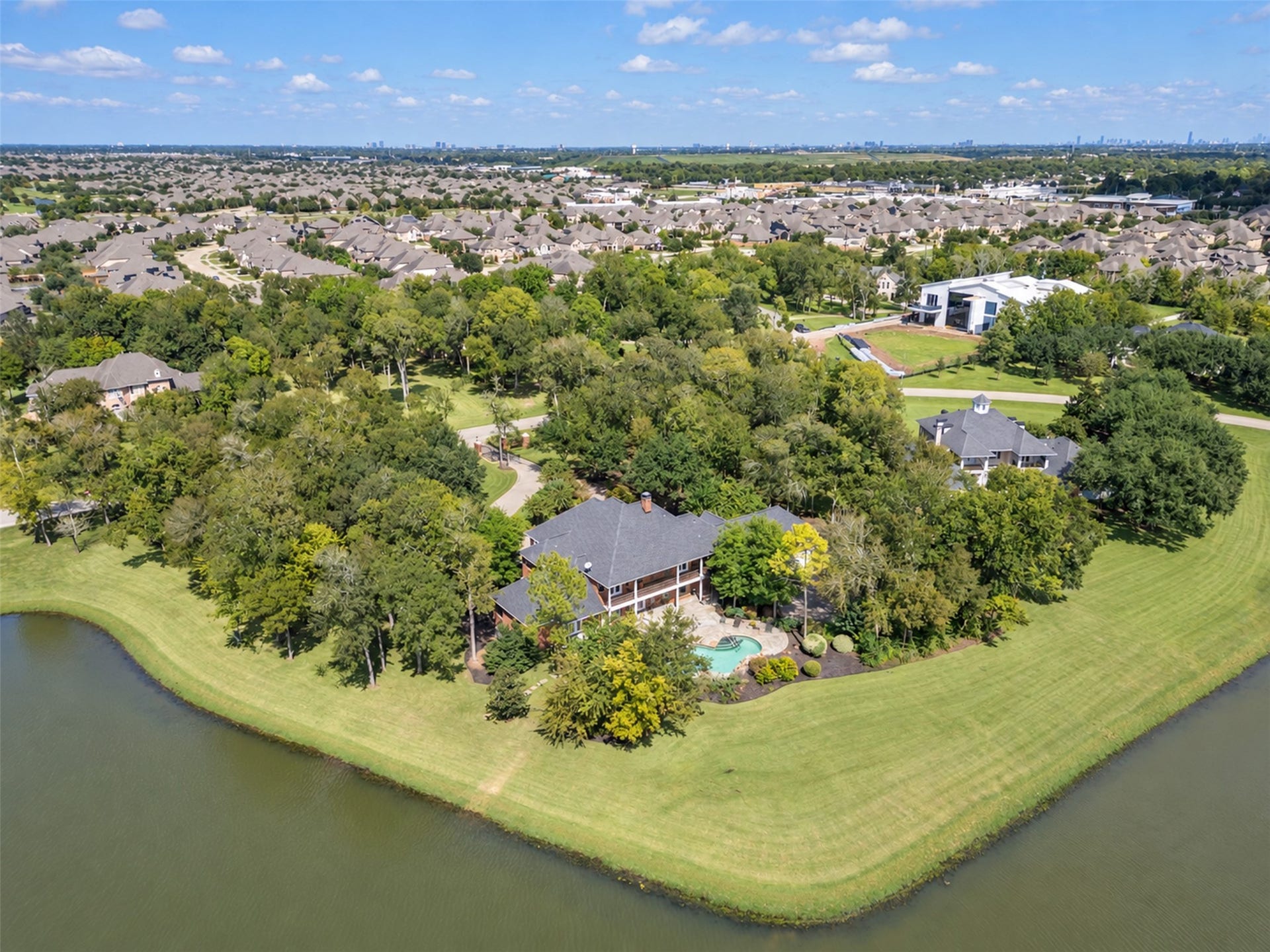 11602 haley hollow, Richmond, TX 77407 This exquisite property has hundreds of feet of shoreline and extensive grounds