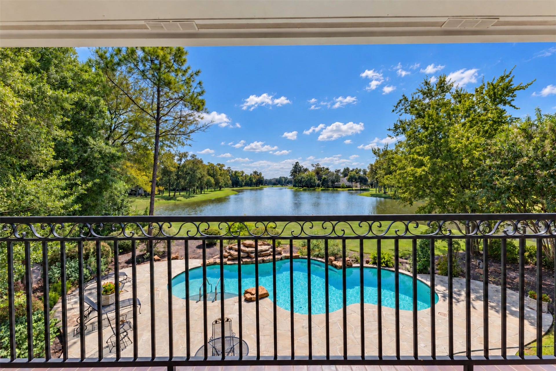 11602 haley hollow, Richmond, TX 77407 The second floor balcony with its pool and lake views.