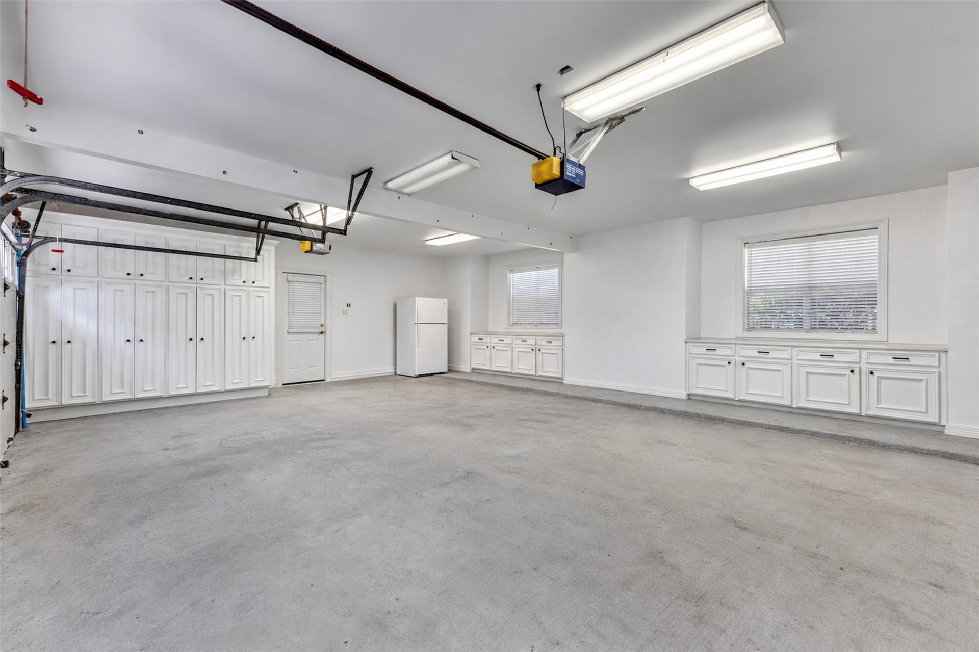 11602 haley hollow, Richmond, TX 77407 Inside the garage. Note the builtins and space for extra fridge and freezers
