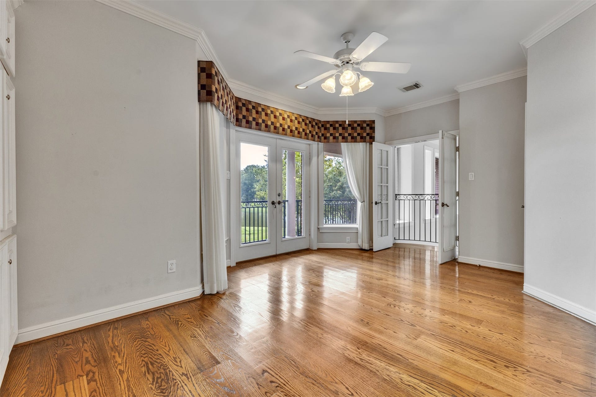 11602 haley hollow, Richmond, TX 77407 The upstairs playroom features a built-in desk, a bay window, and a Juliet balcony.