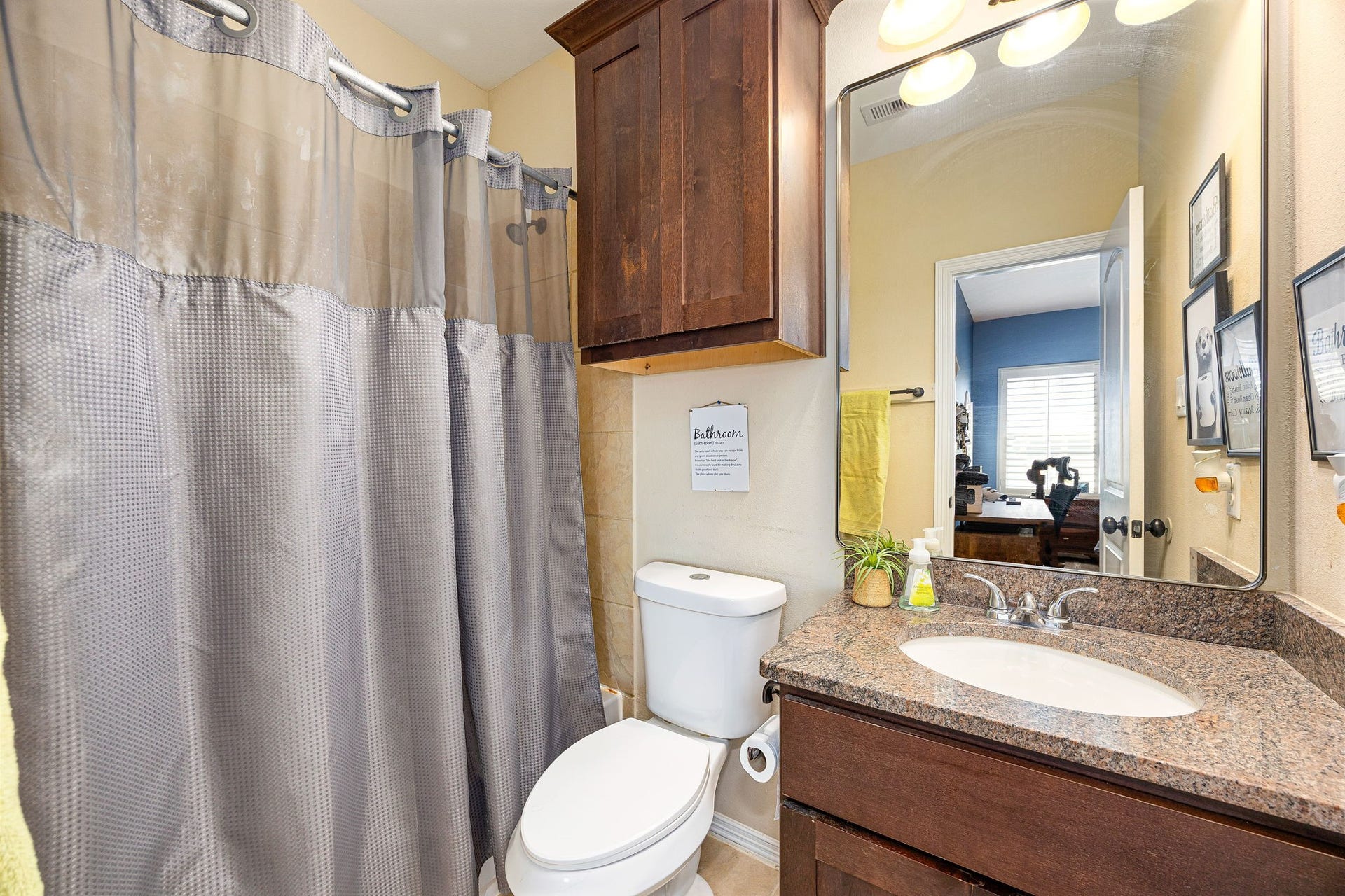 5102 Hawthorne Bend Drive, Katy, TX 77494 Clean and functional! This secondary bath features granite countertops, dark wood cabinetry, a large vanity mirror, and a tub/shower combo, everything you need! *Virtually Staged