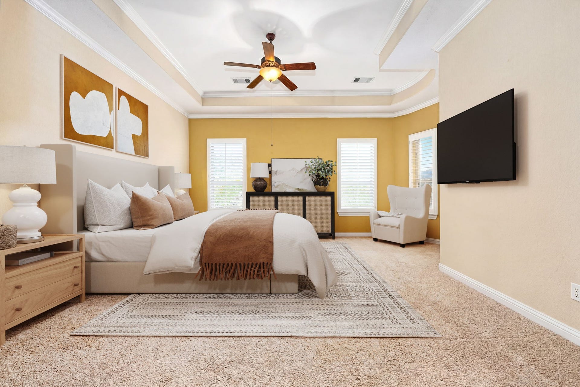 5102 Hawthorne Bend Drive, Katy, TX 77494 Your personal retreat awaits! This spacious primary suite features a gorgeous tray ceiling with crown molding, ceiling fan, plush carpet, plantation shutters, and warm golden accent walls. Pure luxury. *Virtually Staged