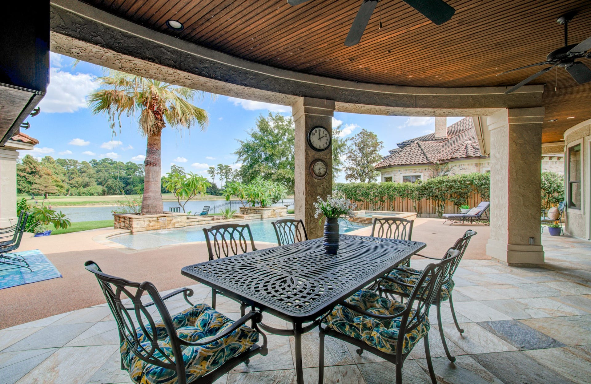 Enjoy a waterfront and golf course view from every corner of the backyard