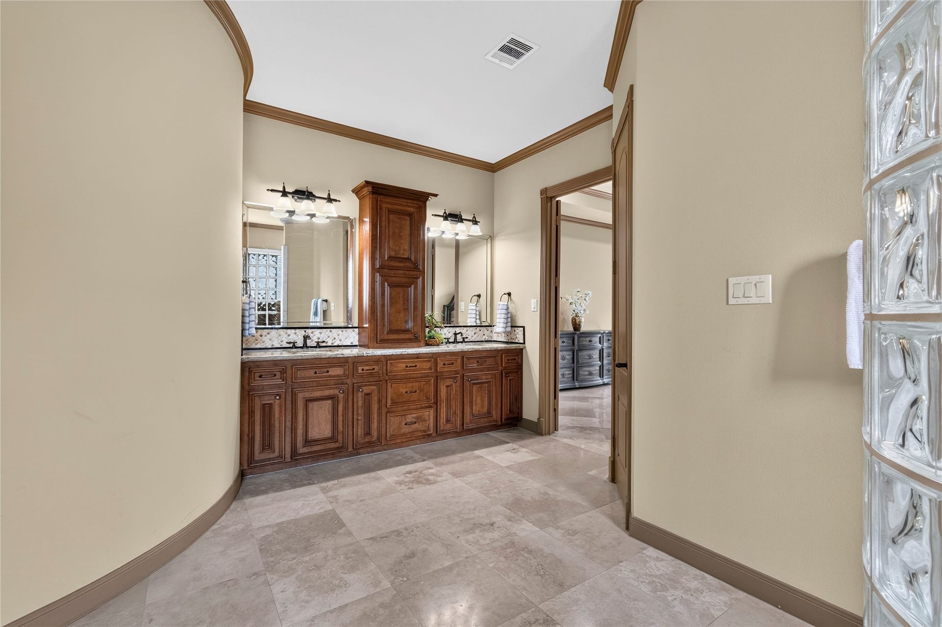 Another view of the oversized primary bath with extra storage and double vanities