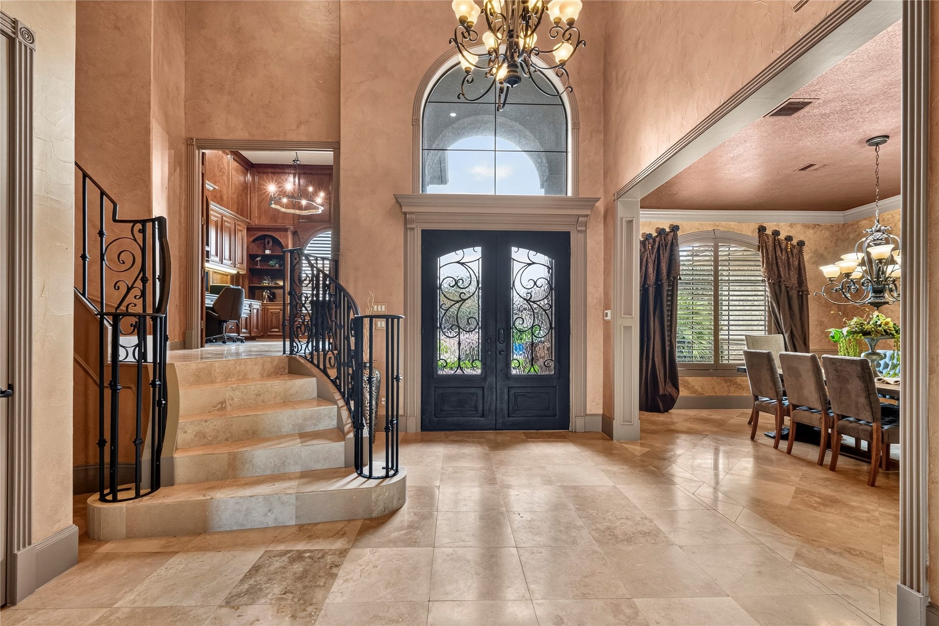 A view of the front doors and foyer from inside the home