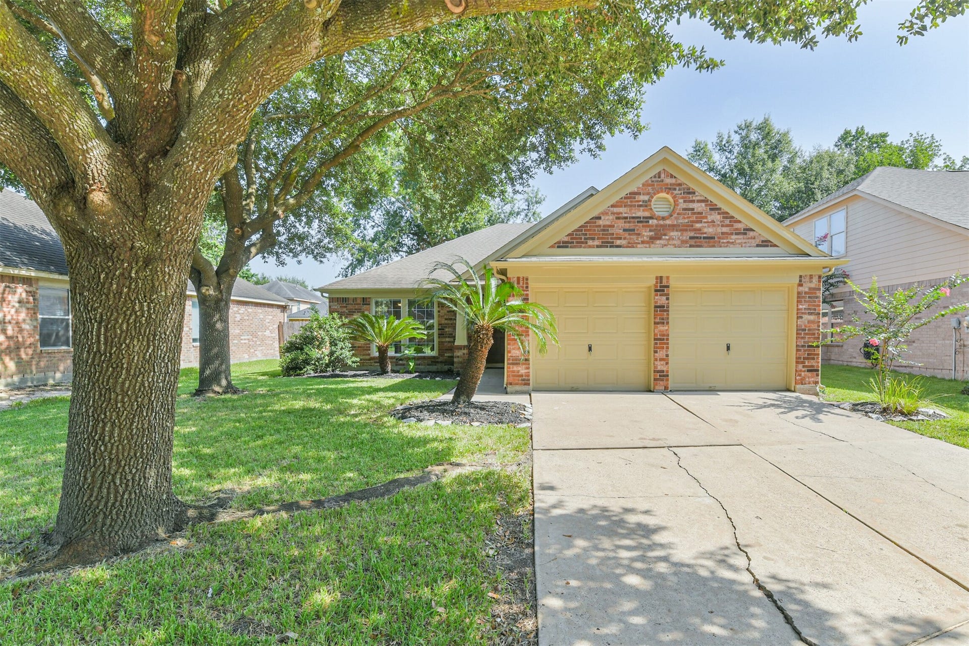 12939 Cascadia Knoll Court, Humble, TX 77346 Welcome home! Check out the charming curb appeal with mature shade trees, lush landscaping, and a spacious two-car garage.