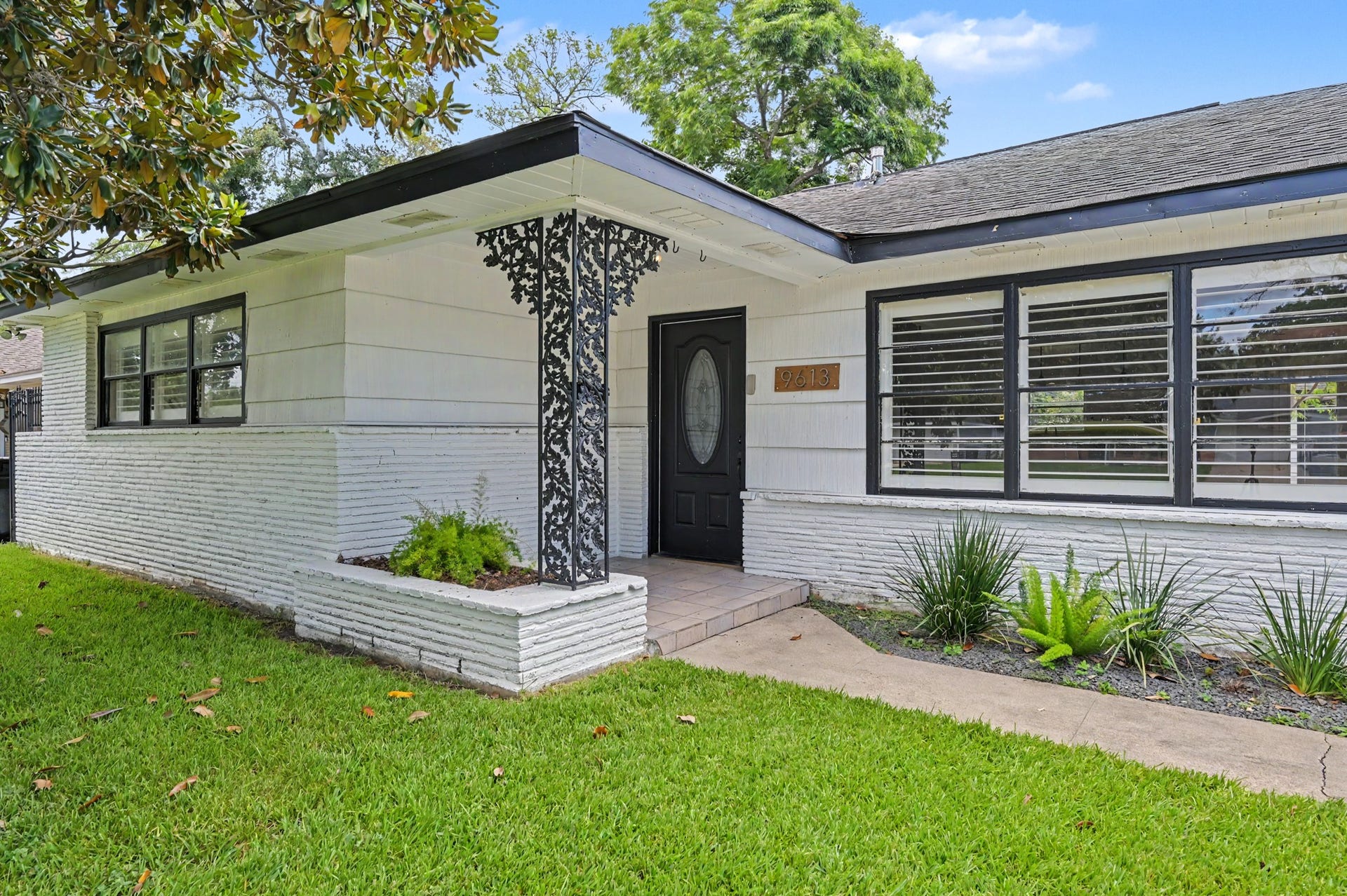 9613 Westview Drive, Houston, TX 77055 Lots of Charm in this white and black eclectic home with cute front porch
