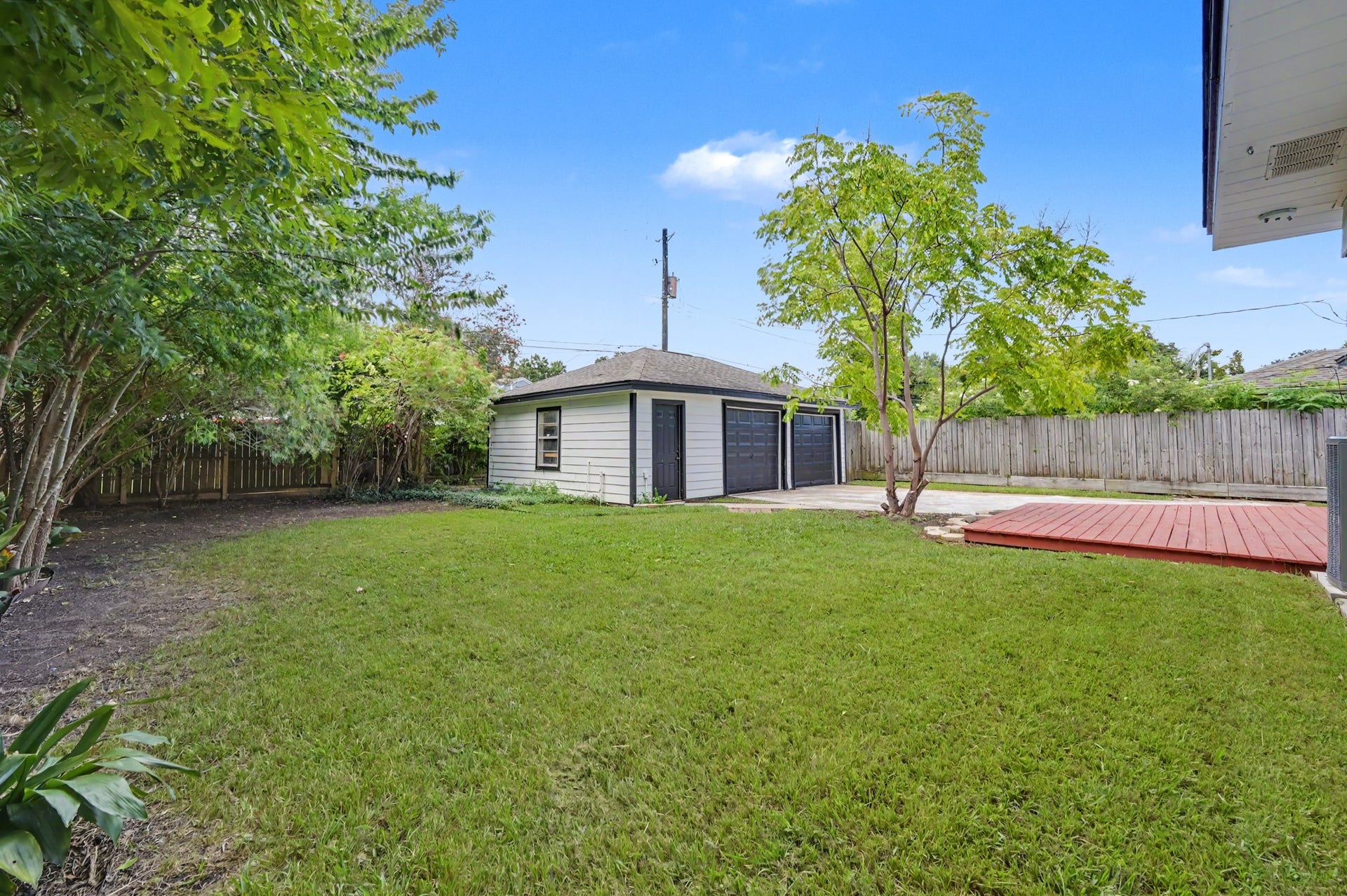 9613 Westview Drive, Houston, TX 77055 Good size backyard + a detached two car garage plus utility area inside the garage