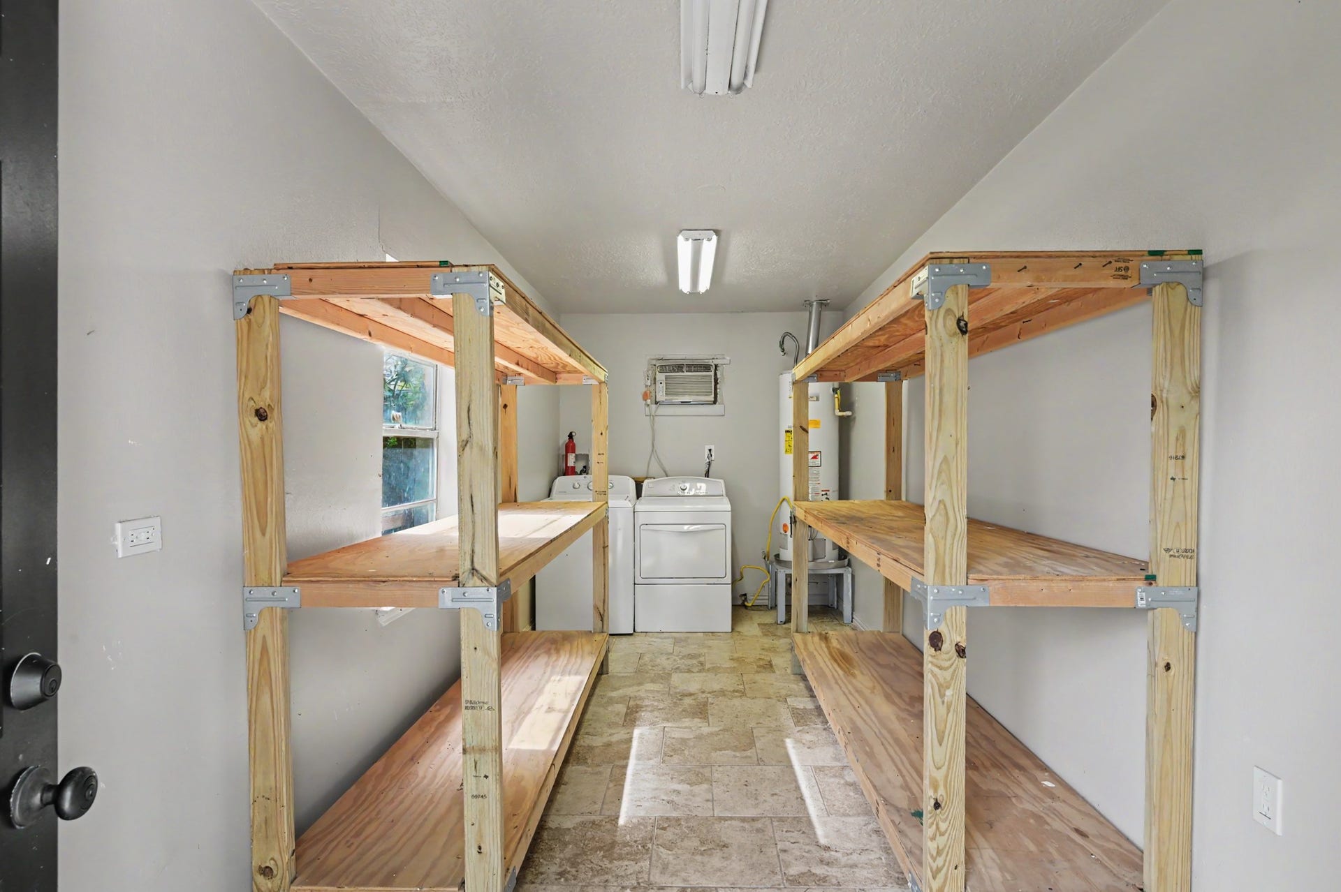 9613 Westview Drive, Houston, TX 77055 Utility room inside the garage is quite large and offers lots of storage area