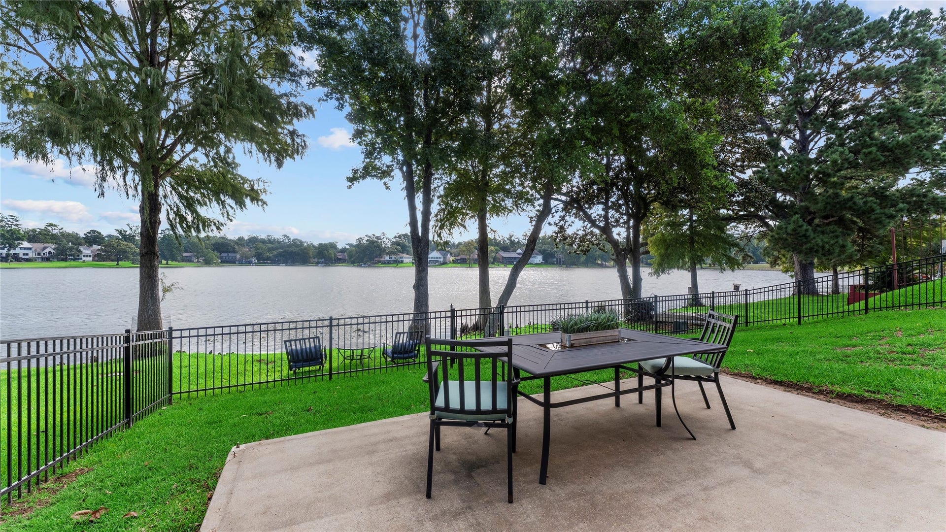 1600 Wimbledon Drive, Huntsville, TX 77340 Wroght iron fenced patio area.