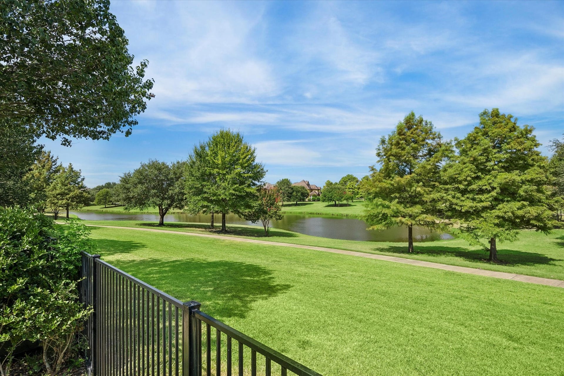 18715 N Thomas Shore Drive, Cypress, TX 77433 Beautiful view of the walking trail and lake from the backyard