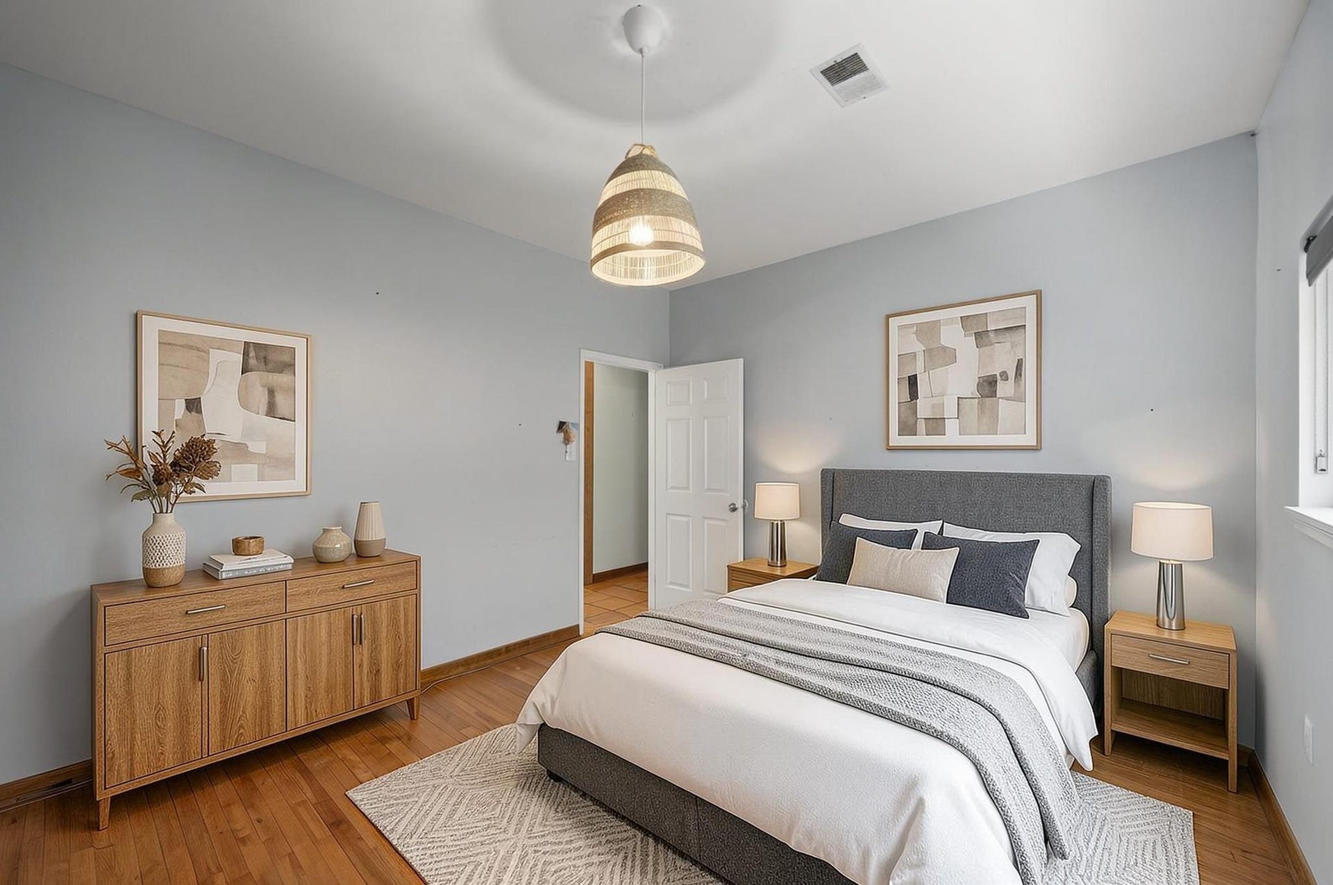 11807 Carriage Hill Drive, Houston, TX 77077 This additional bedroom offers usable space with natural light and wood flooring. It works well as a bedroom, office, hobby room, or guest space. Virtually staged.