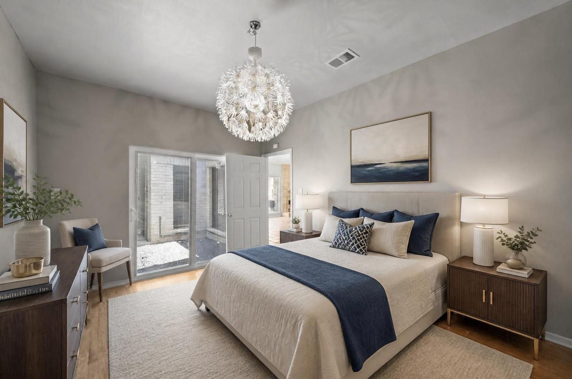 11807 Carriage Hill Drive, Houston, TX 77077 This secondary bedroom offers a comfortable first-floor space with wood flooring, natural light, and a simple layout. It can serve as a bedroom, office, guest room, or quiet retreat. Virtually staged.
