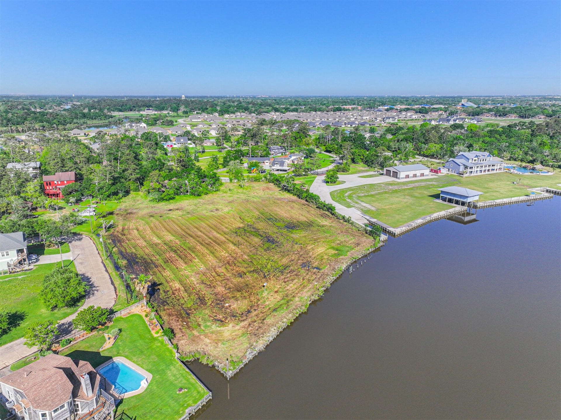 Beautiful Homes on Adjoining Properties! Lots of Additional Space to Build a Boathouse and/or Launch.